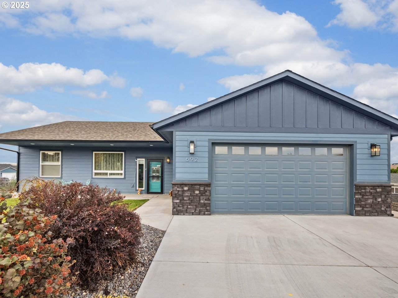 692 Southwest Runnion Avenue Pendleton, OR 97801 - Photo 30 of 35 a front view of a house with a yard and garage