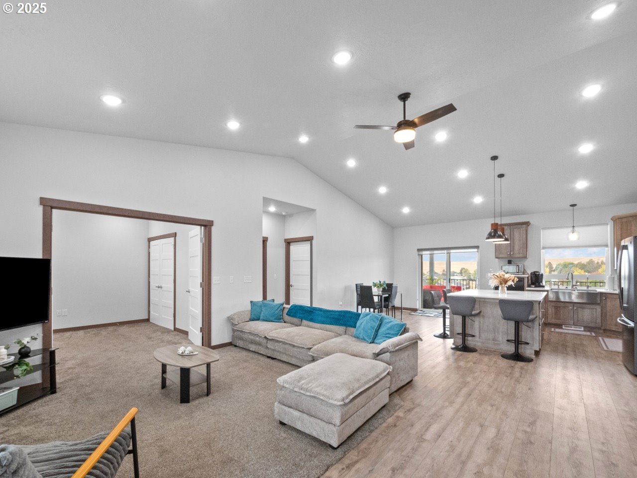 692 Southwest Runnion Avenue Pendleton, OR 97801 - Photo 3 of 35 a living room with furniture and a flat screen tv
