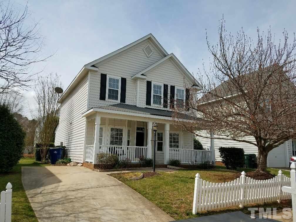 5021 Village Lawn Drive Raleigh, NC 27613 - Photo 1 of 9 a front view of a house with a yard