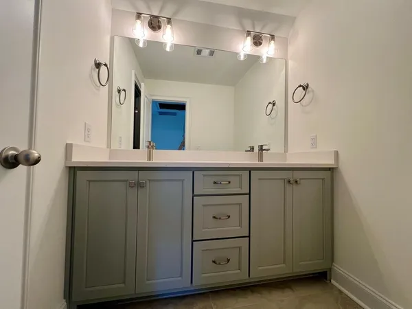 a white toilet sitting next to a bath tub