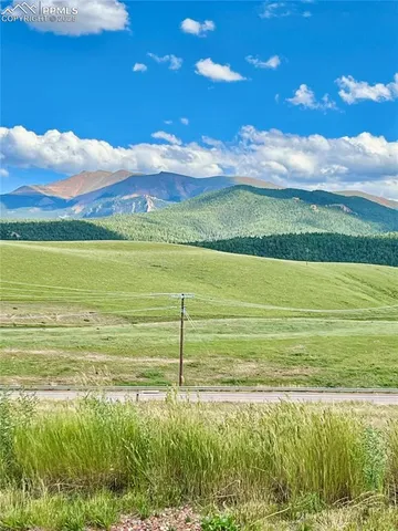 a view of an ocean and a mountain