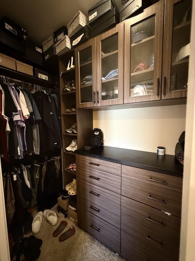 600 Tennessee Street, Unit 108 Memphis, TN 38103 - Photo 15 of 23 a view of walk in closet with clothes and shoes