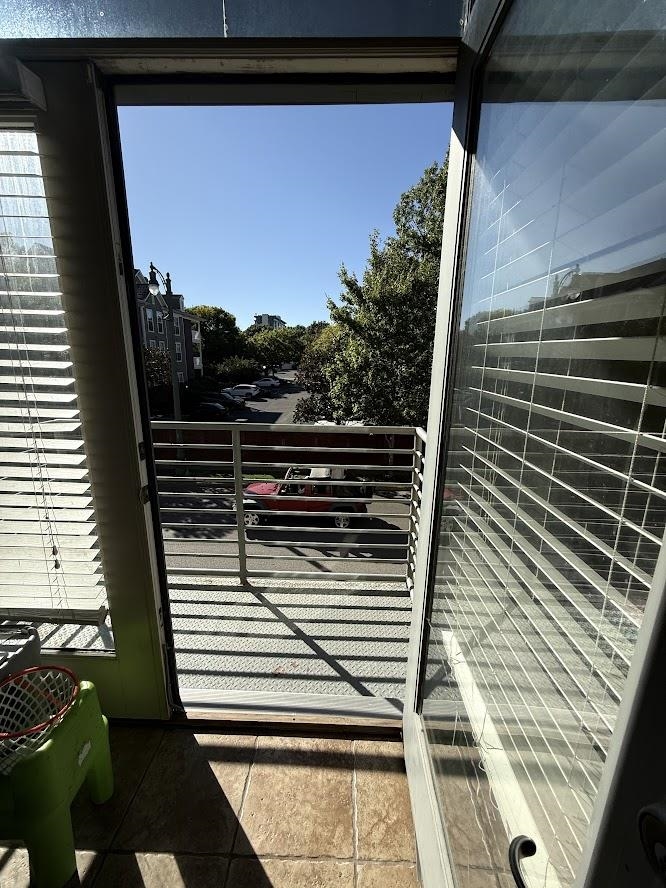 600 Tennessee Street, Unit 108 Memphis, TN 38103 - Photo 19 of 23 a view of a balcony with wooden floor and fence