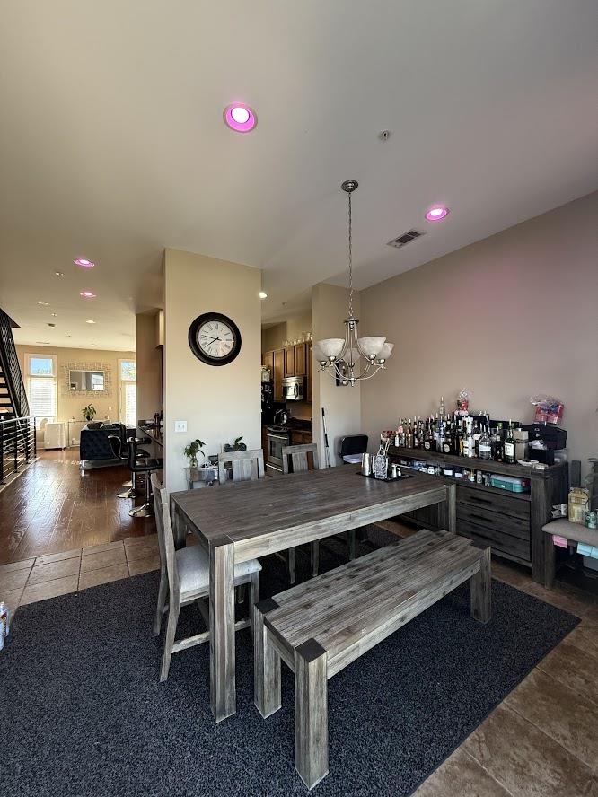 600 Tennessee Street, Unit 108 Memphis, TN 38103 - Photo 8 of 23 a dining hall with couches a table and chairs with wooden floor
