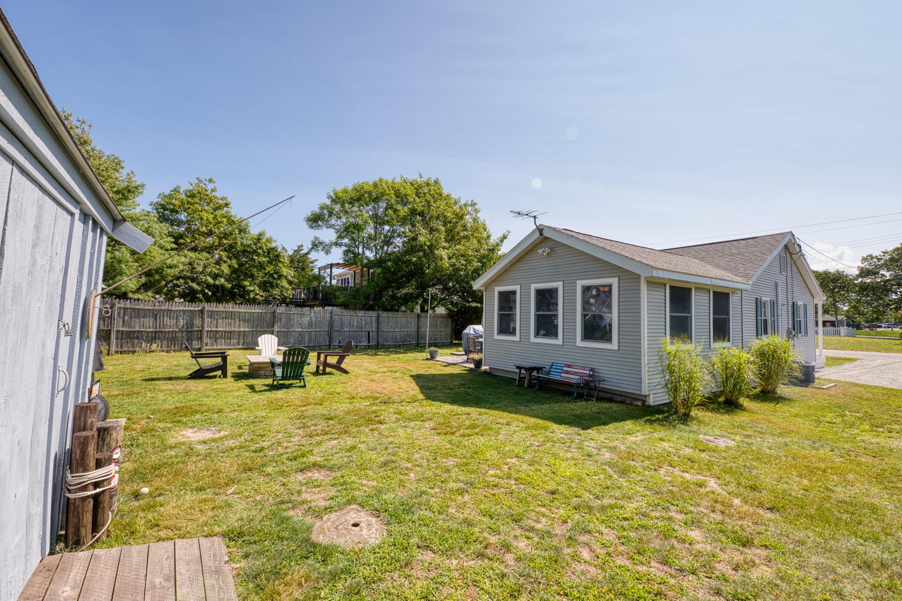 41 Bourne Neck Drive Buzzards Bay, MA 02532 - Photo 12 of 52 a house with swimming pool in front of it