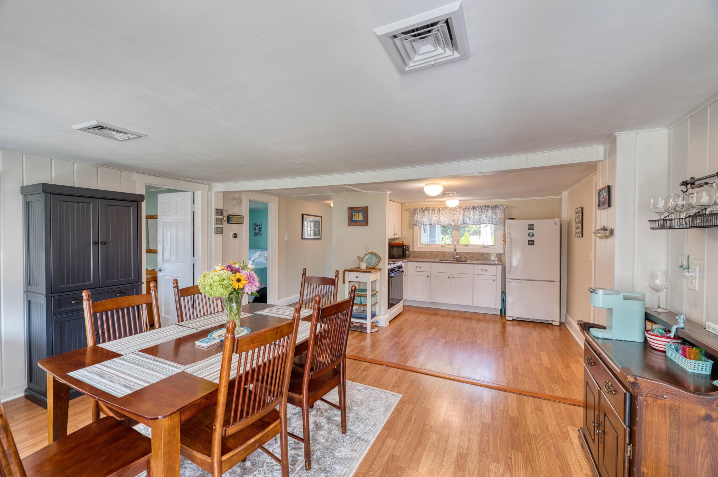 41 Bourne Neck Drive Buzzards Bay, MA 02532 - Photo 20 of 52 a view of a dining room with furniture and chandelier