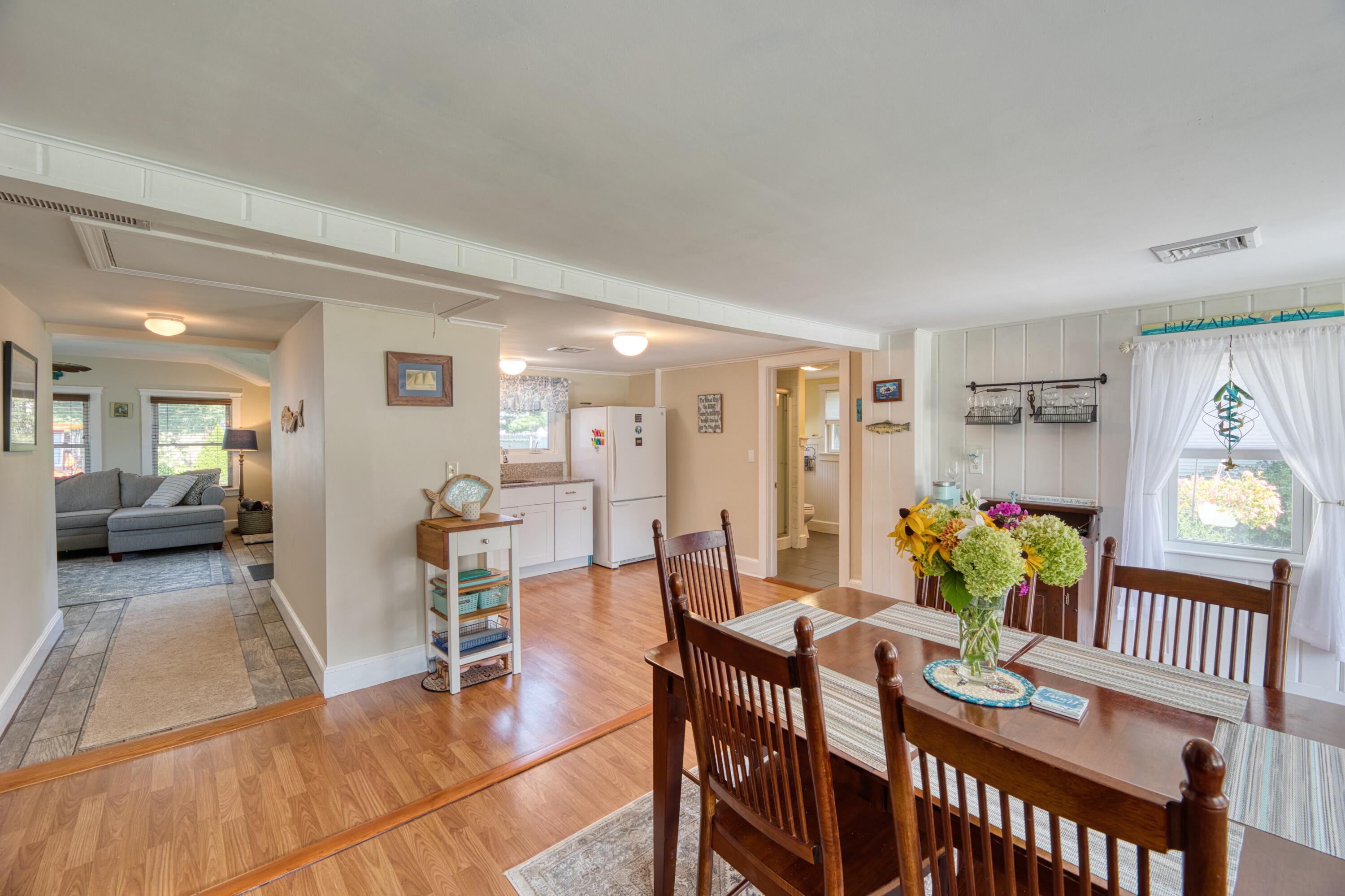 41 Bourne Neck Drive Buzzards Bay, MA 02532 - Photo 21 of 52 a view of a dining room with furniture and a potted plant