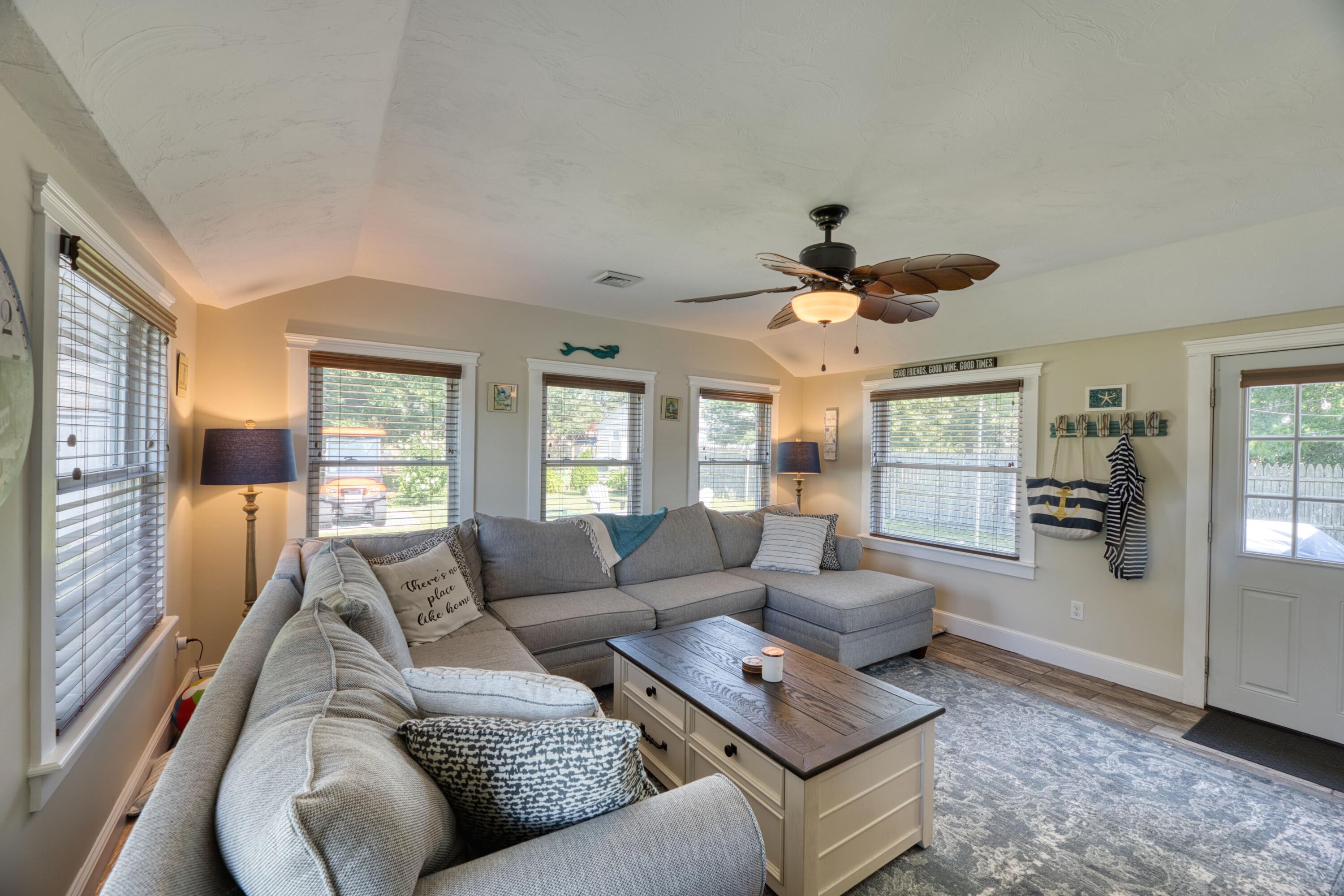 41 Bourne Neck Drive Buzzards Bay, MA 02532 - Photo 29 of 52 a living room with furniture and a large window