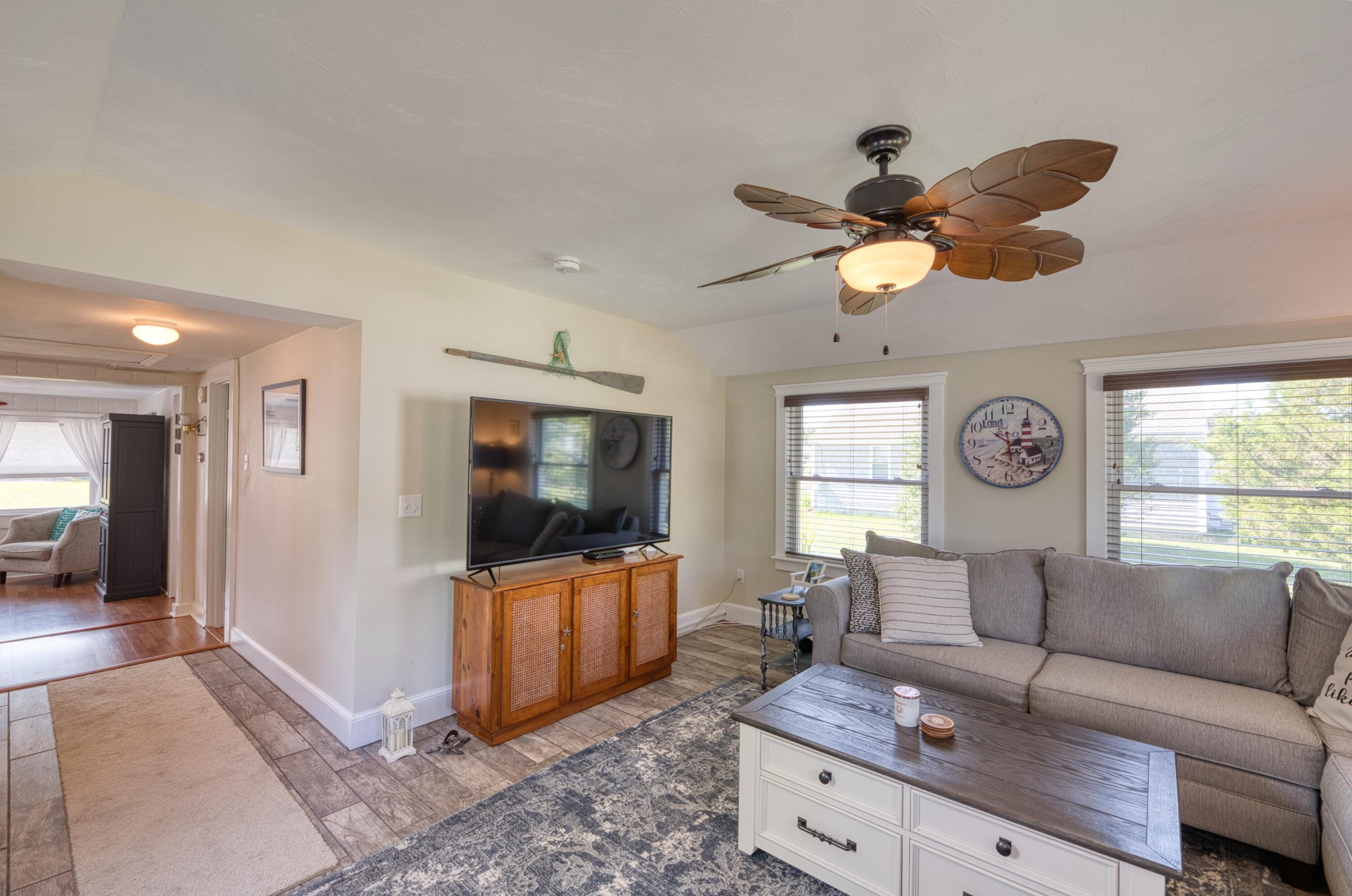41 Bourne Neck Drive Buzzards Bay, MA 02532 - Photo 31 of 52 a living room with furniture and a flat screen tv