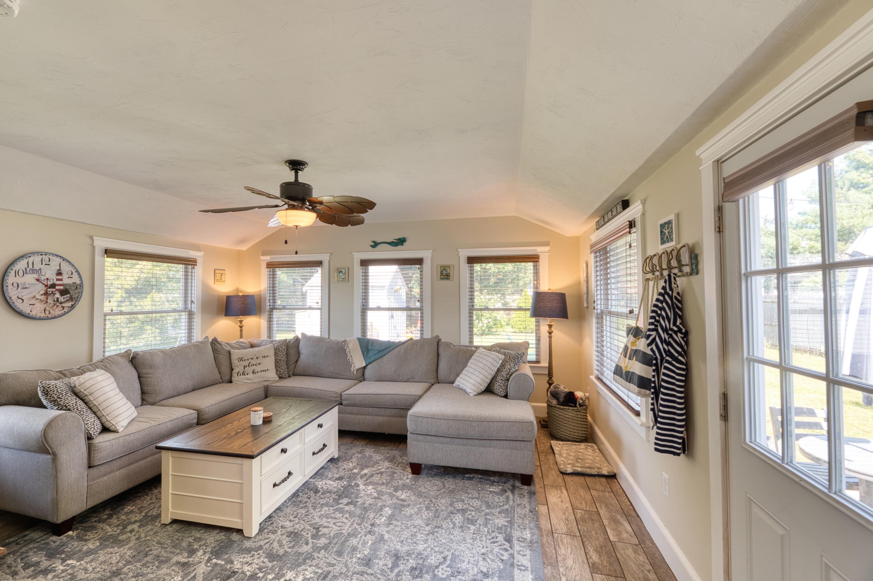 41 Bourne Neck Drive Buzzards Bay, MA 02532 - Photo 32 of 52 a living room with furniture and a large window