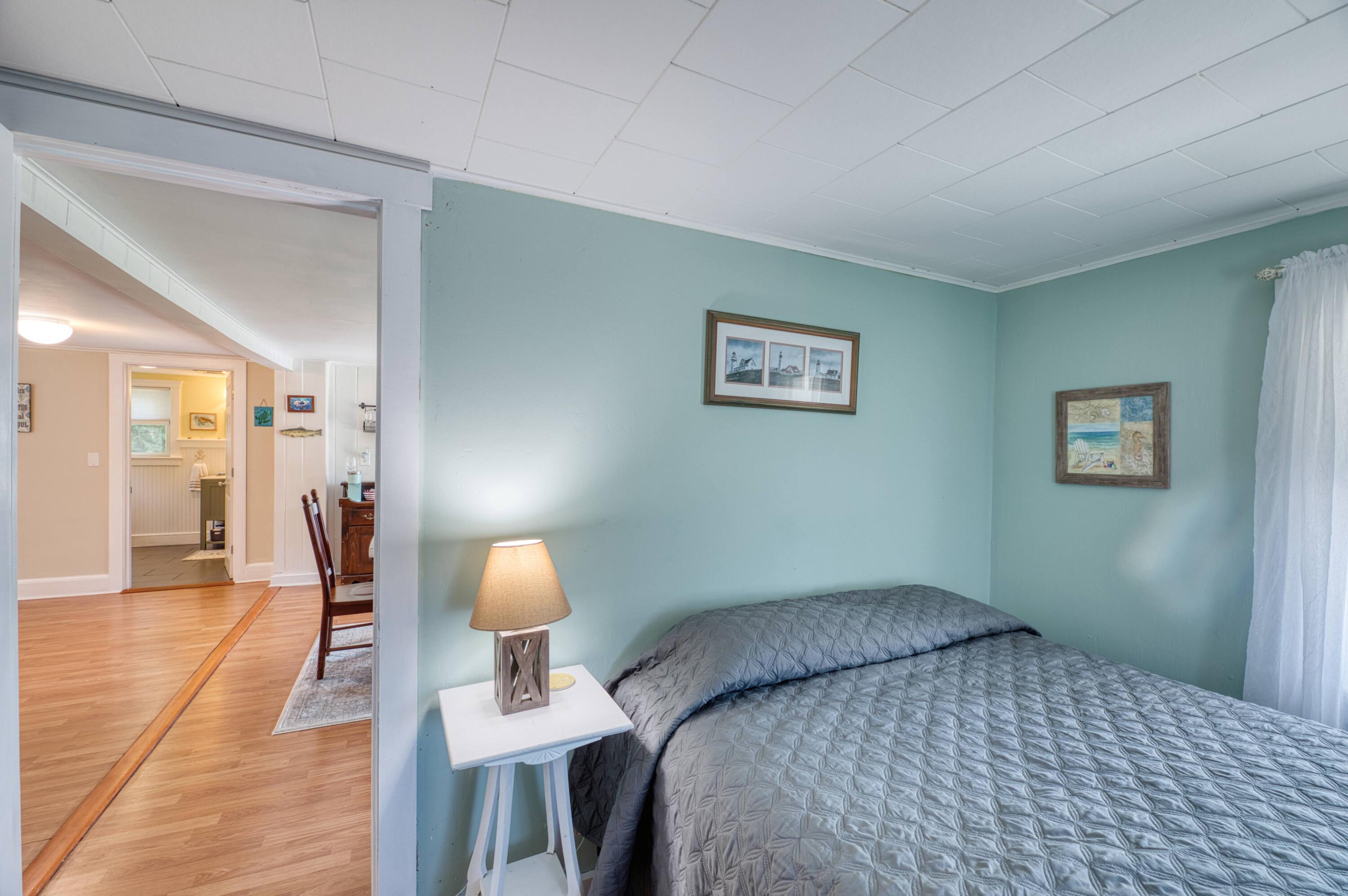 41 Bourne Neck Drive Buzzards Bay, MA 02532 - Photo 35 of 52 a bedroom with a bed and wooden floor