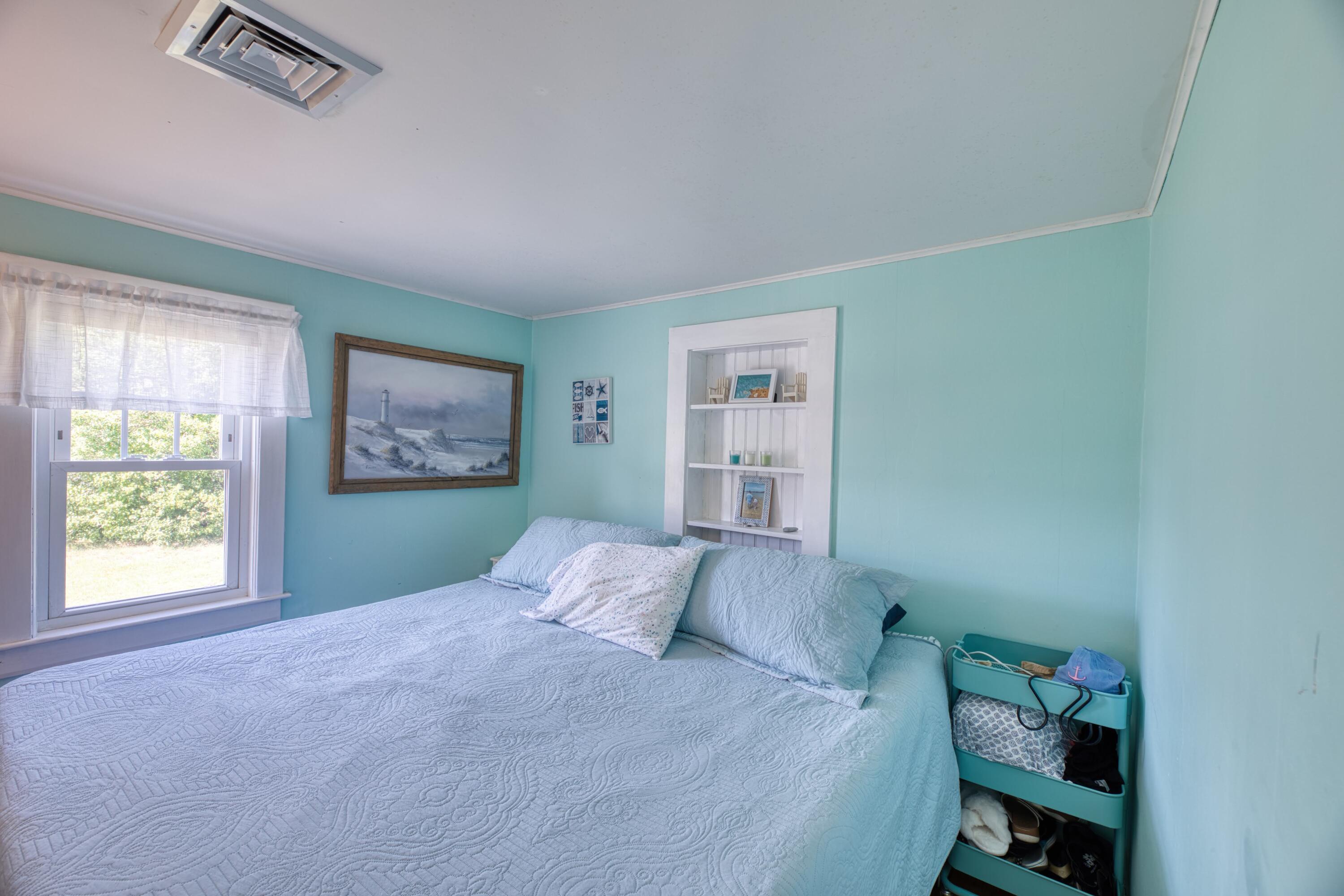 41 Bourne Neck Drive Buzzards Bay, MA 02532 - Photo 38 of 52 a bedroom with a bed and a window