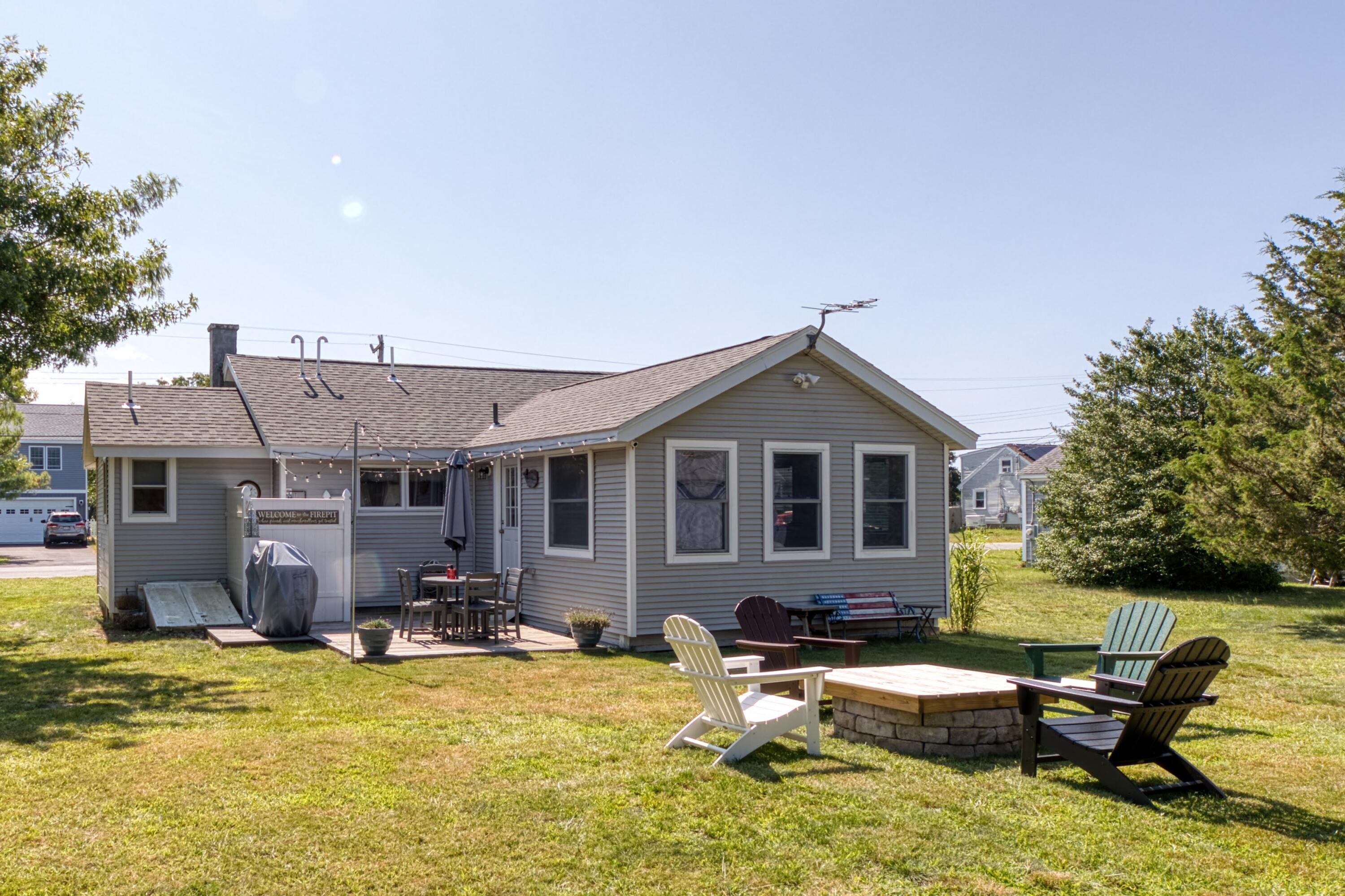 41 Bourne Neck Drive Buzzards Bay, MA 02532 - Photo 8 of 52 a view of a house with swimming pool and sitting area