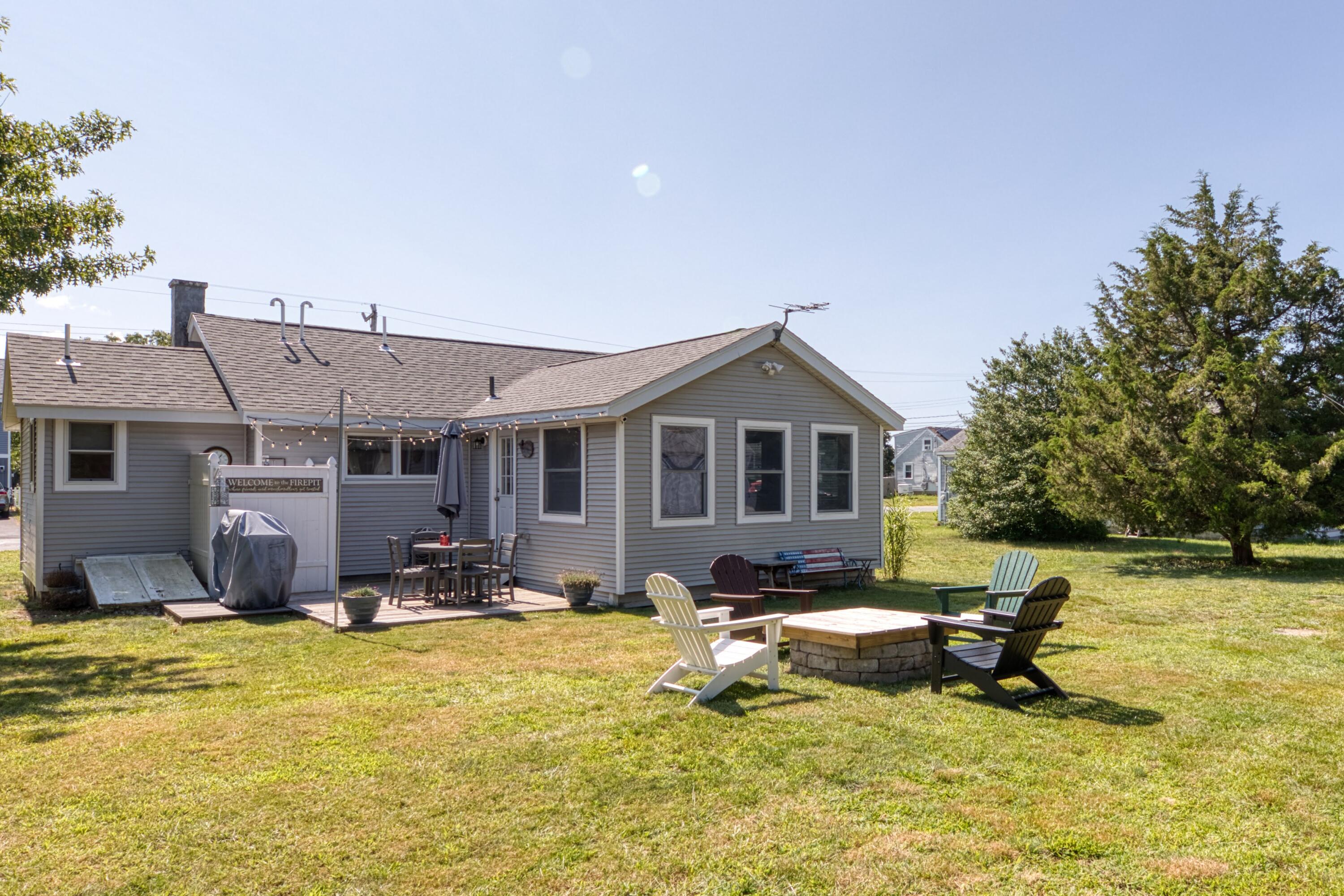 41 Bourne Neck Drive Buzzards Bay, MA 02532 - Photo 9 of 52 a view of a house with swimming pool and sitting area
