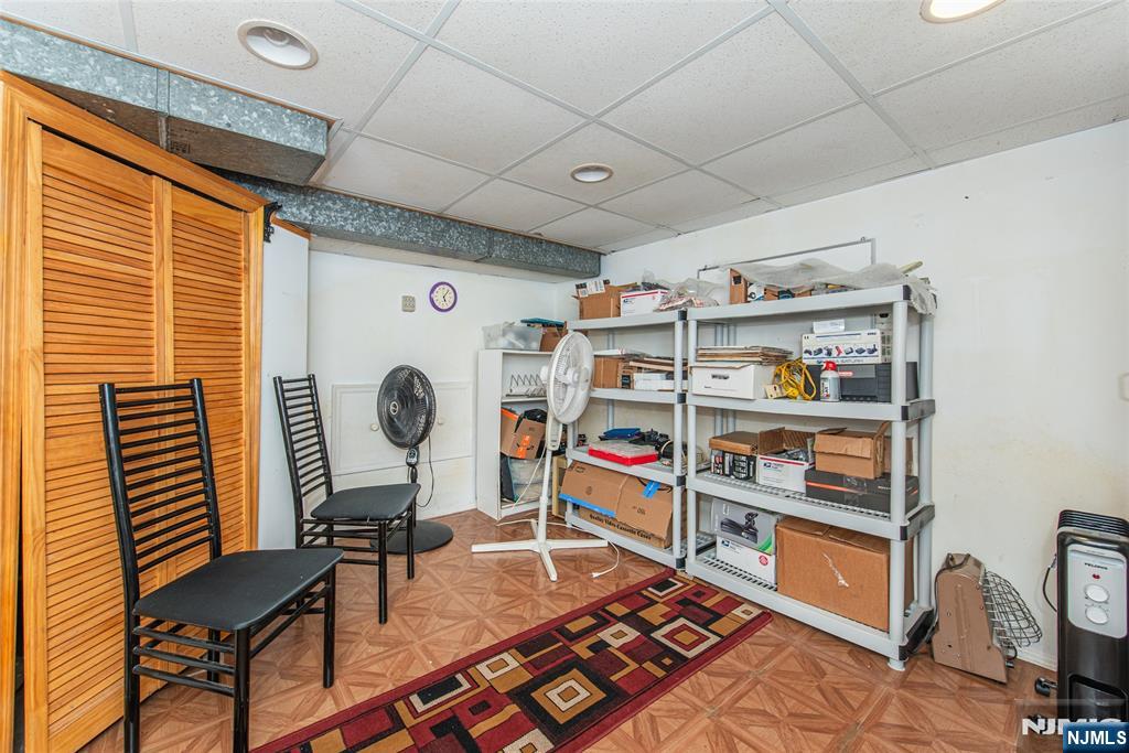 12 Abbott Road Wayne, NJ 07470 - Photo 36 of 49 a room with furniture a rug and a book shelf