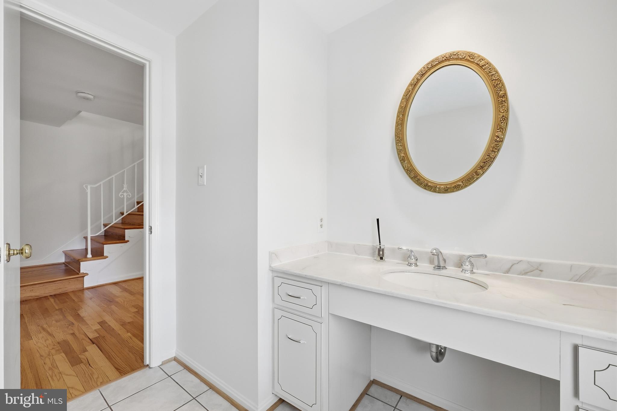 12428 Over Ridge Road Potomac, MD 20854 - Photo 13 of 81 a bathroom with a sink and a mirror