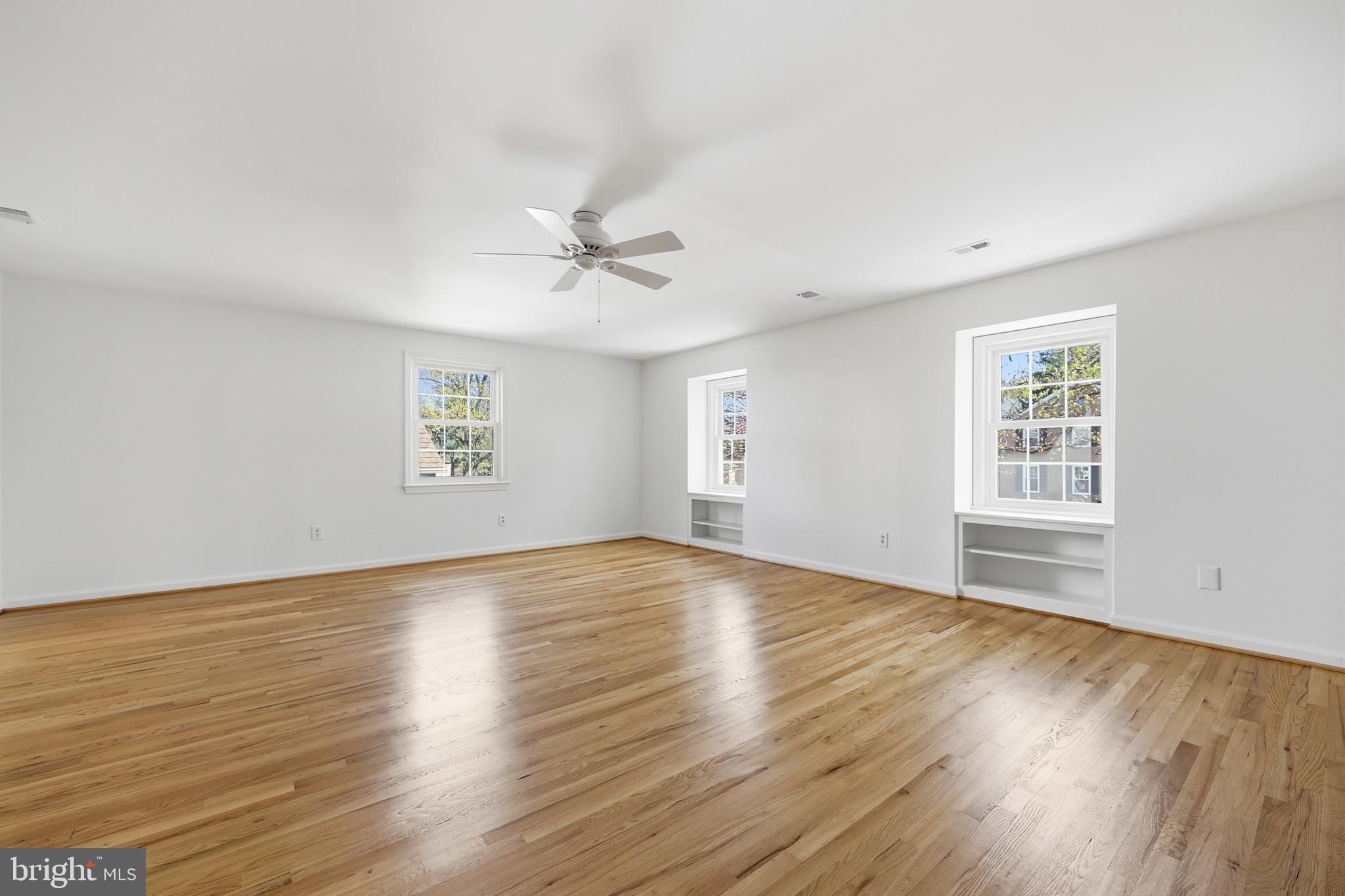 12428 Over Ridge Road Potomac, MD 20854 - Photo 33 of 81 a view of an empty room with wooden floor and a window