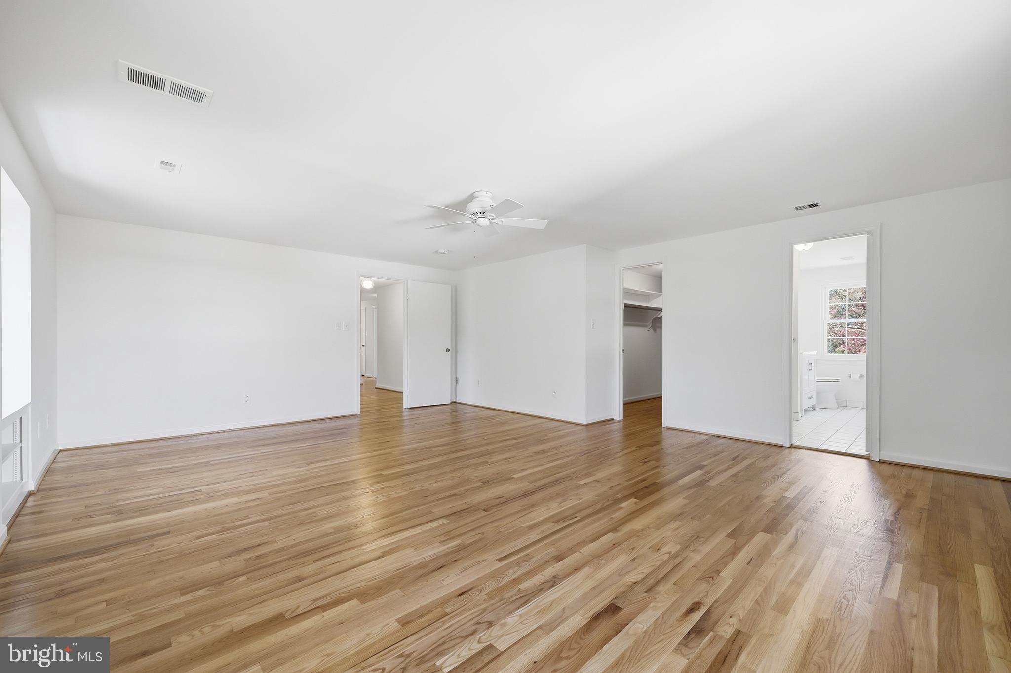 12428 Over Ridge Road Potomac, MD 20854 - Photo 35 of 81 a view of an empty room with wooden floor and a window