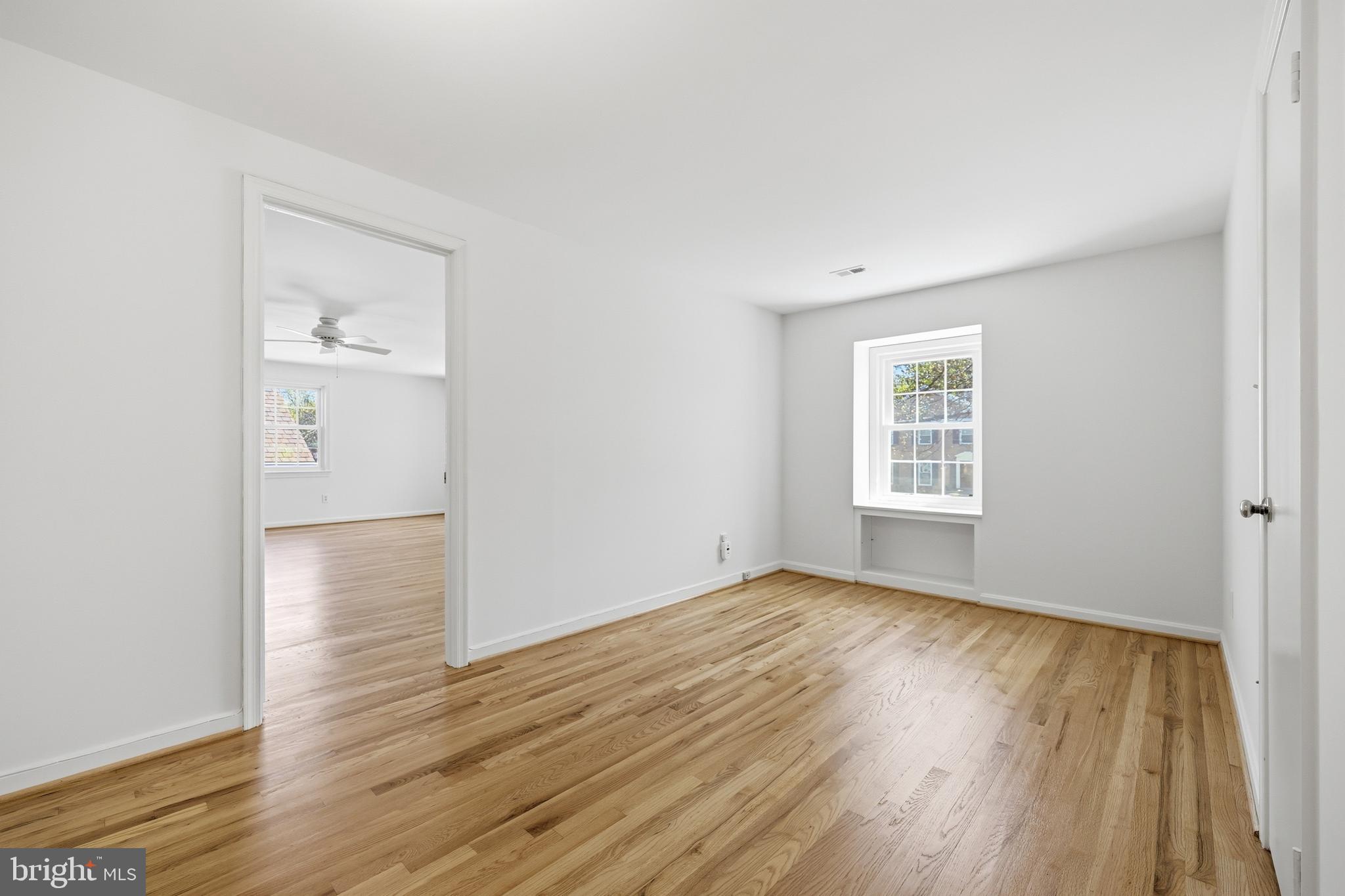 12428 Over Ridge Road Potomac, MD 20854 - Photo 42 of 81 an empty room with wooden floor and a window