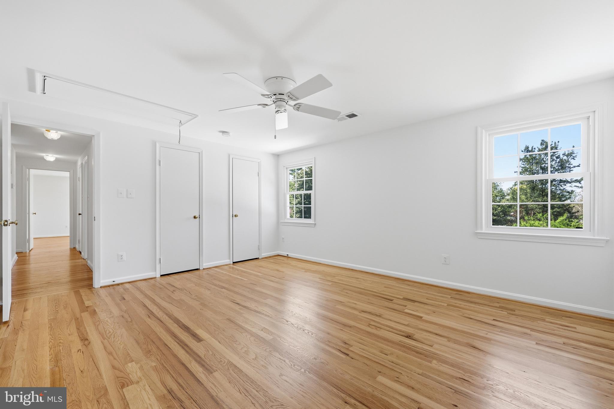 12428 Over Ridge Road Potomac, MD 20854 - Photo 44 of 81 a view of an empty room with wooden floor and a window