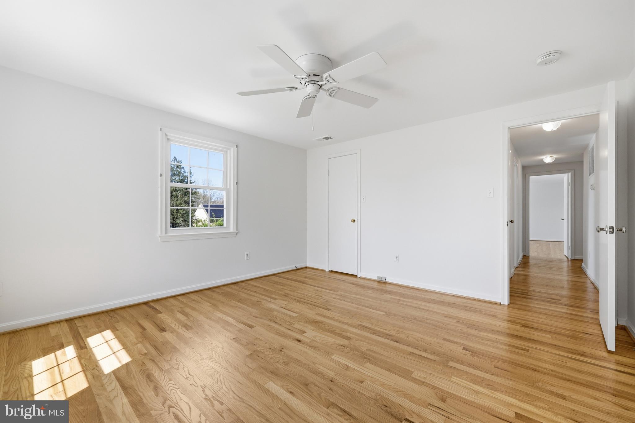 12428 Over Ridge Road Potomac, MD 20854 - Photo 49 of 81 wooden floor in an empty room with a window