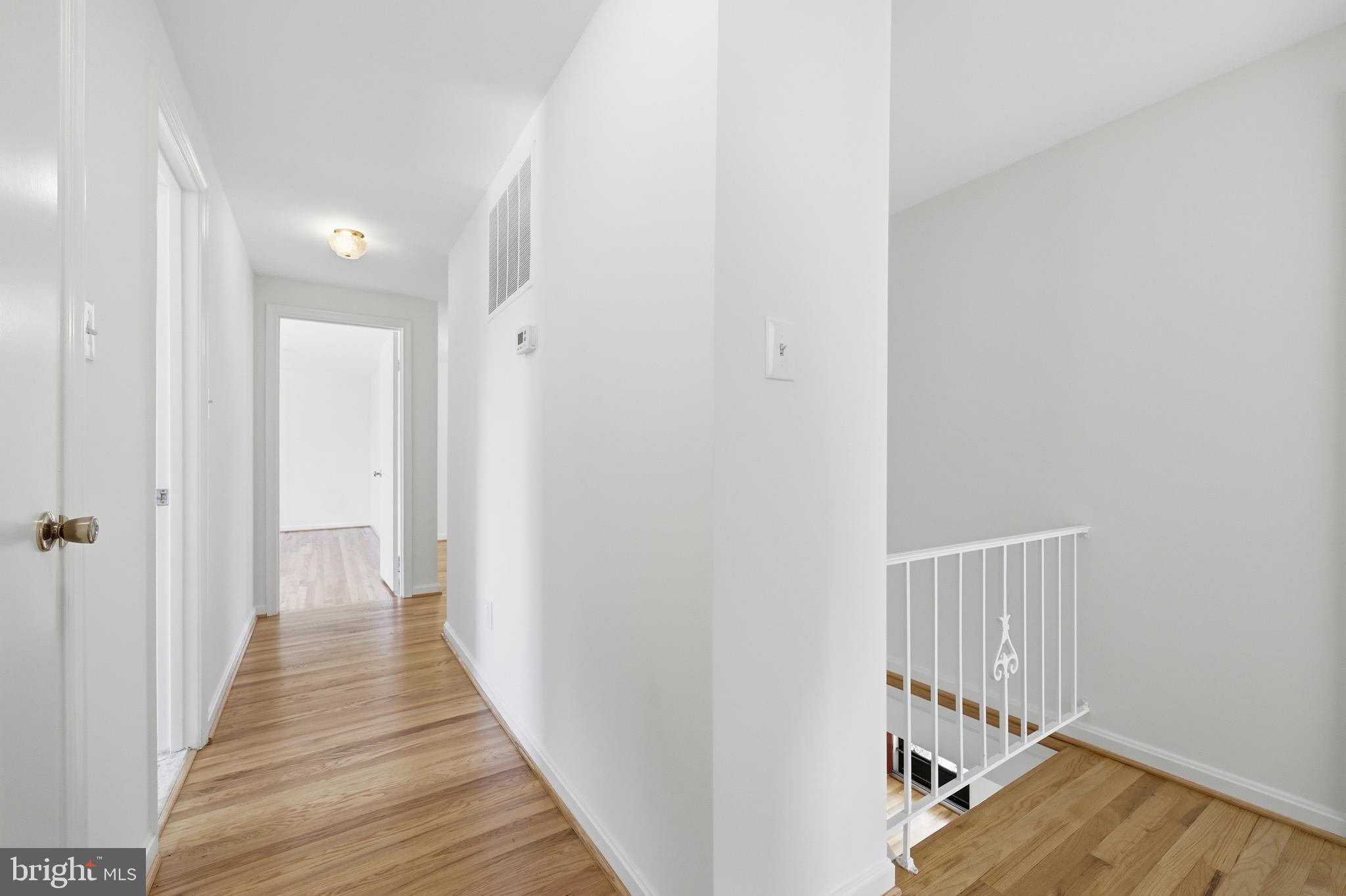 12428 Over Ridge Road Potomac, MD 20854 - Photo 51 of 81 a view of a hallway with wooden floor