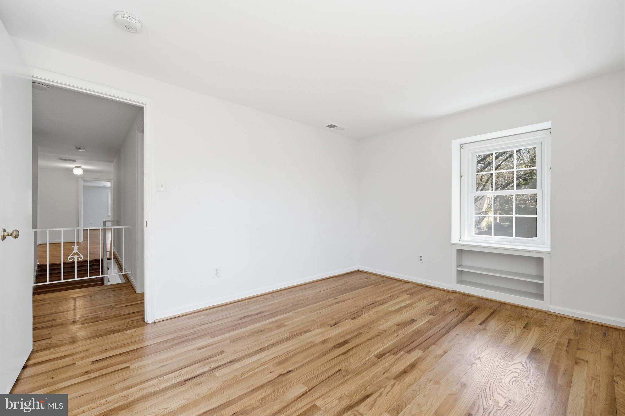 12428 Over Ridge Road Potomac, MD 20854 - Photo 53 of 81 wooden floor in an empty room with a window