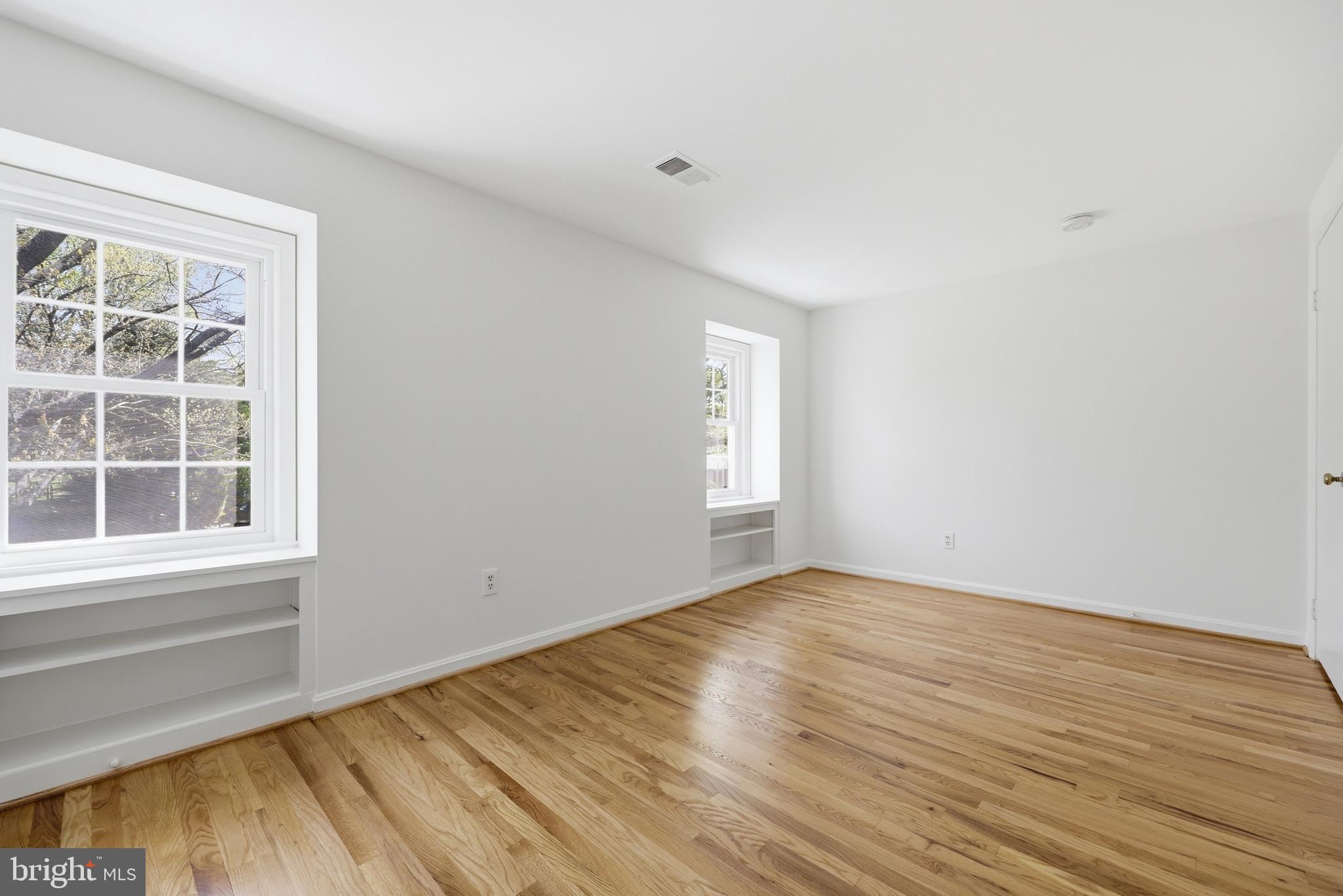 12428 Over Ridge Road Potomac, MD 20854 - Photo 56 of 81 an empty room with wooden floor and windows