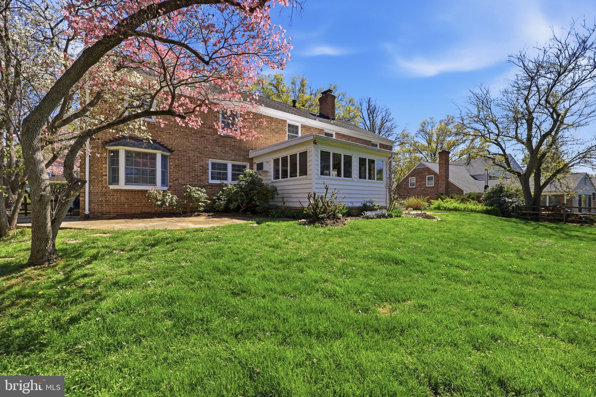 12428 Over Ridge Road Potomac, MD 20854 - Photo 66 of 81 a front view of a house with a garden and trees