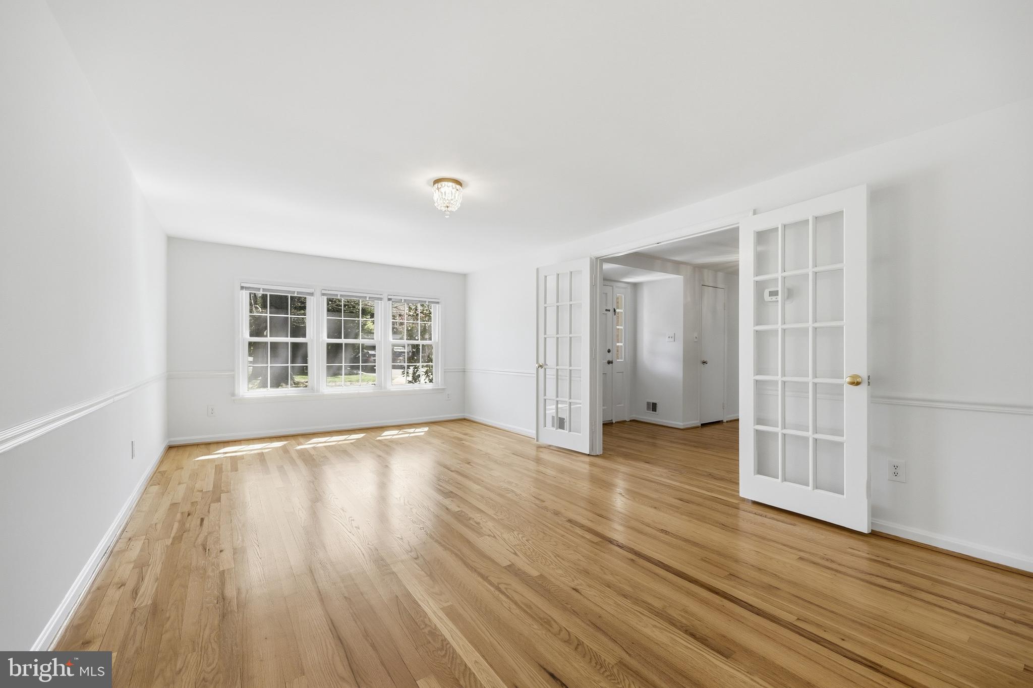 12428 Over Ridge Road Potomac, MD 20854 - Photo 8 of 81 wooden floor in an empty room with a window