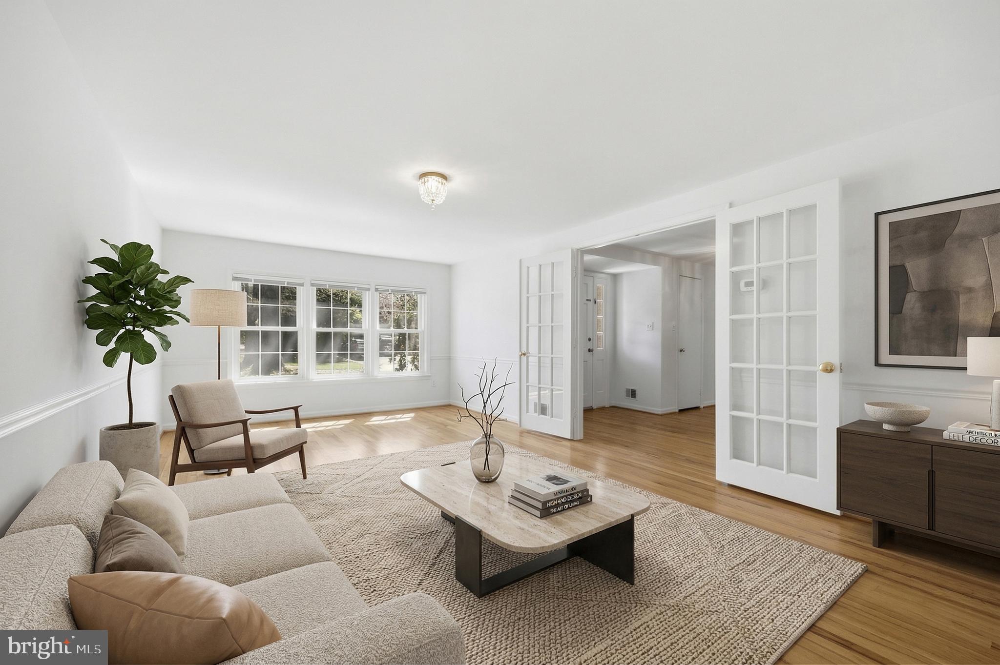 12428 Over Ridge Road Potomac, MD 20854 - Photo 9 of 81 a living room with furniture and a potted plant