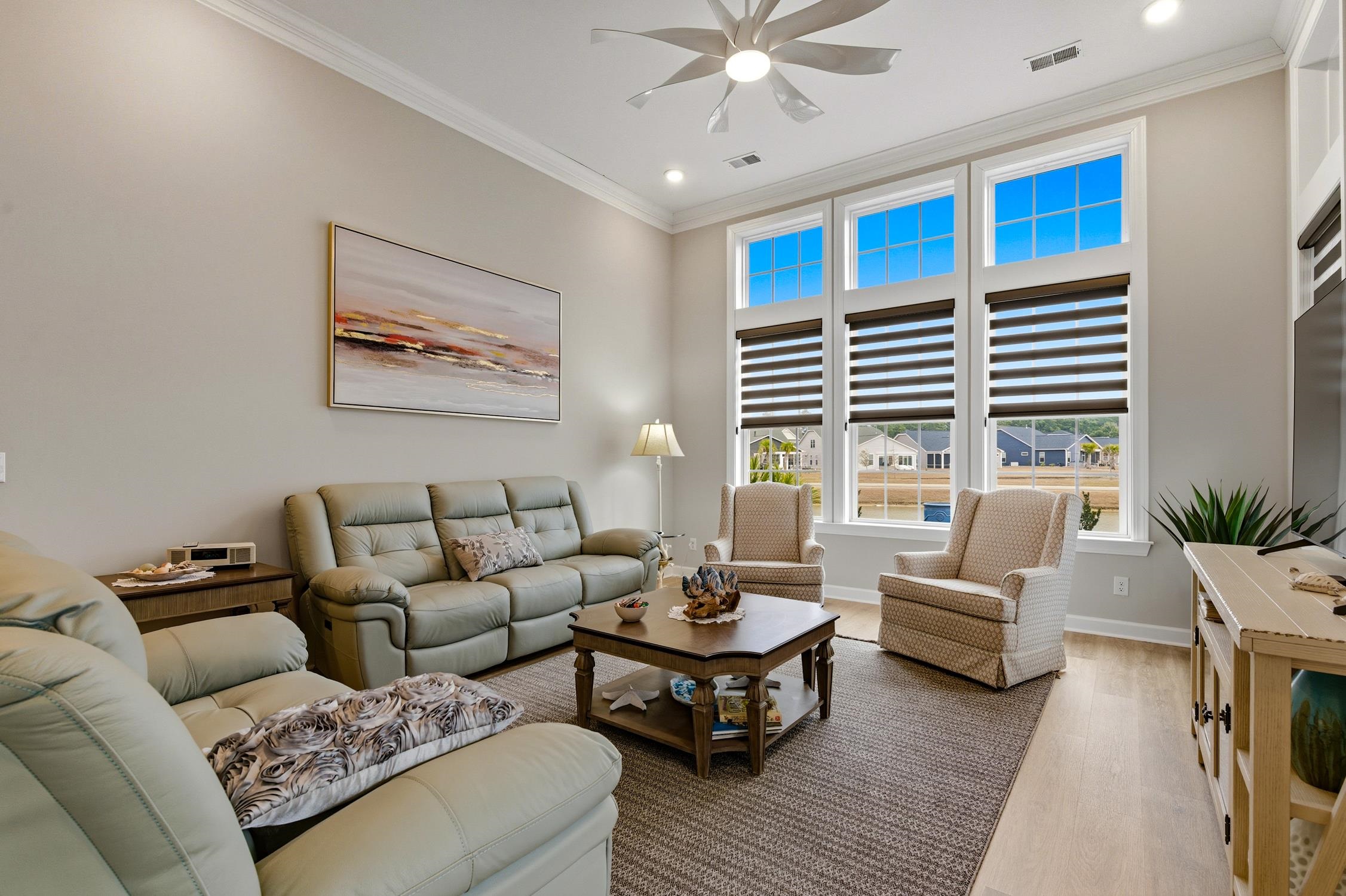 236 Bluestem Loop Little River, SC 29566 - Photo 13 of 40 Living area with crown molding, light wood-style flooring, ceiling fan, and recessed lighting