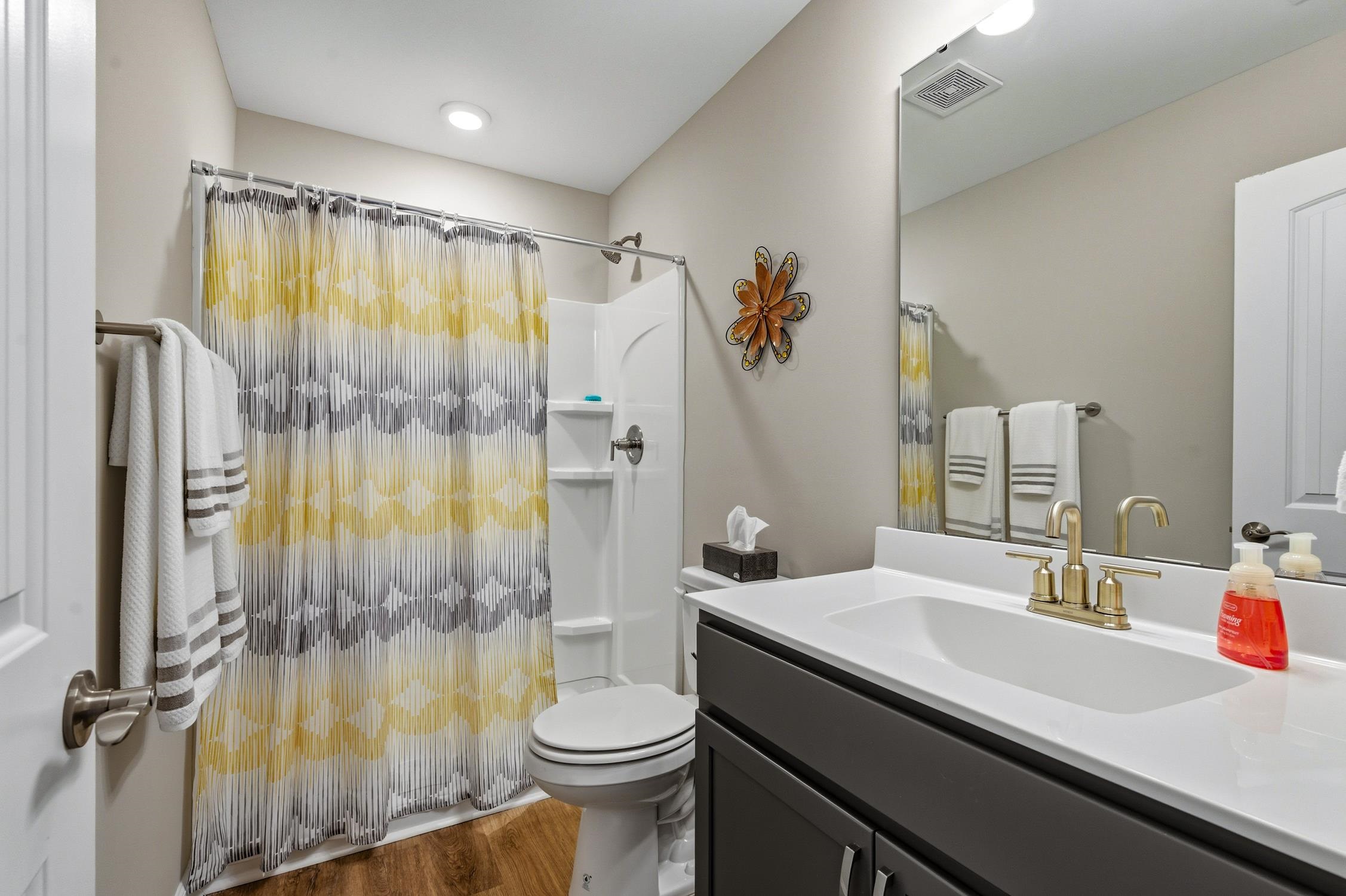 236 Bluestem Loop Little River, SC 29566 - Photo 24 of 40 Bathroom with curtained shower, vanity, and dark wood finished floors