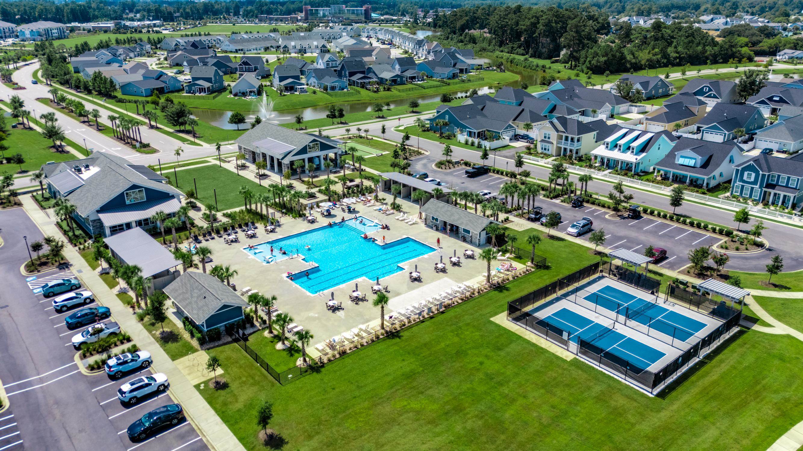 236 Bluestem Loop Little River, SC 29566 - Photo 27 of 40 Aerial view of residential area featuring a pool