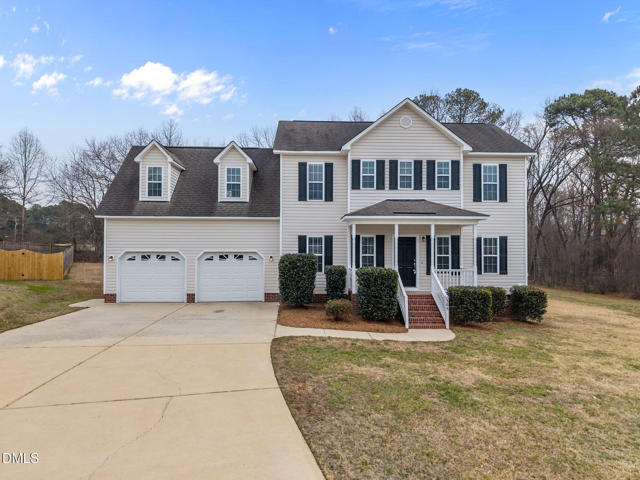 1305 Tawny View Lane Raleigh, NC 27603 - Photo 1 of 47 a front view of a house with a yard garage and outdoor seating