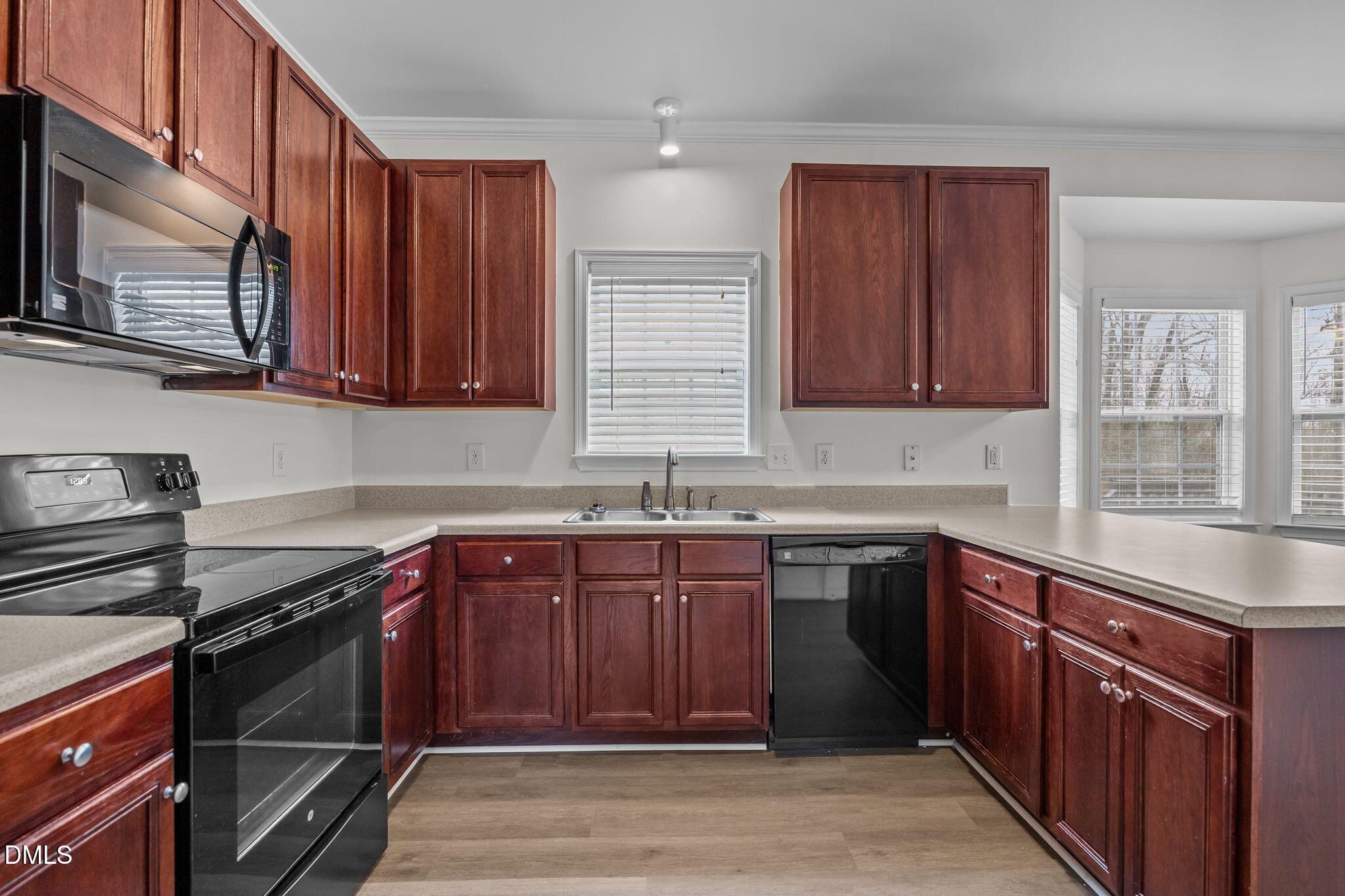 1305 Tawny View Lane Raleigh, NC 27603 - Photo 15 of 47 a kitchen with stainless steel appliances granite countertop wooden cabinets a stove top oven a sink and dishwasher
