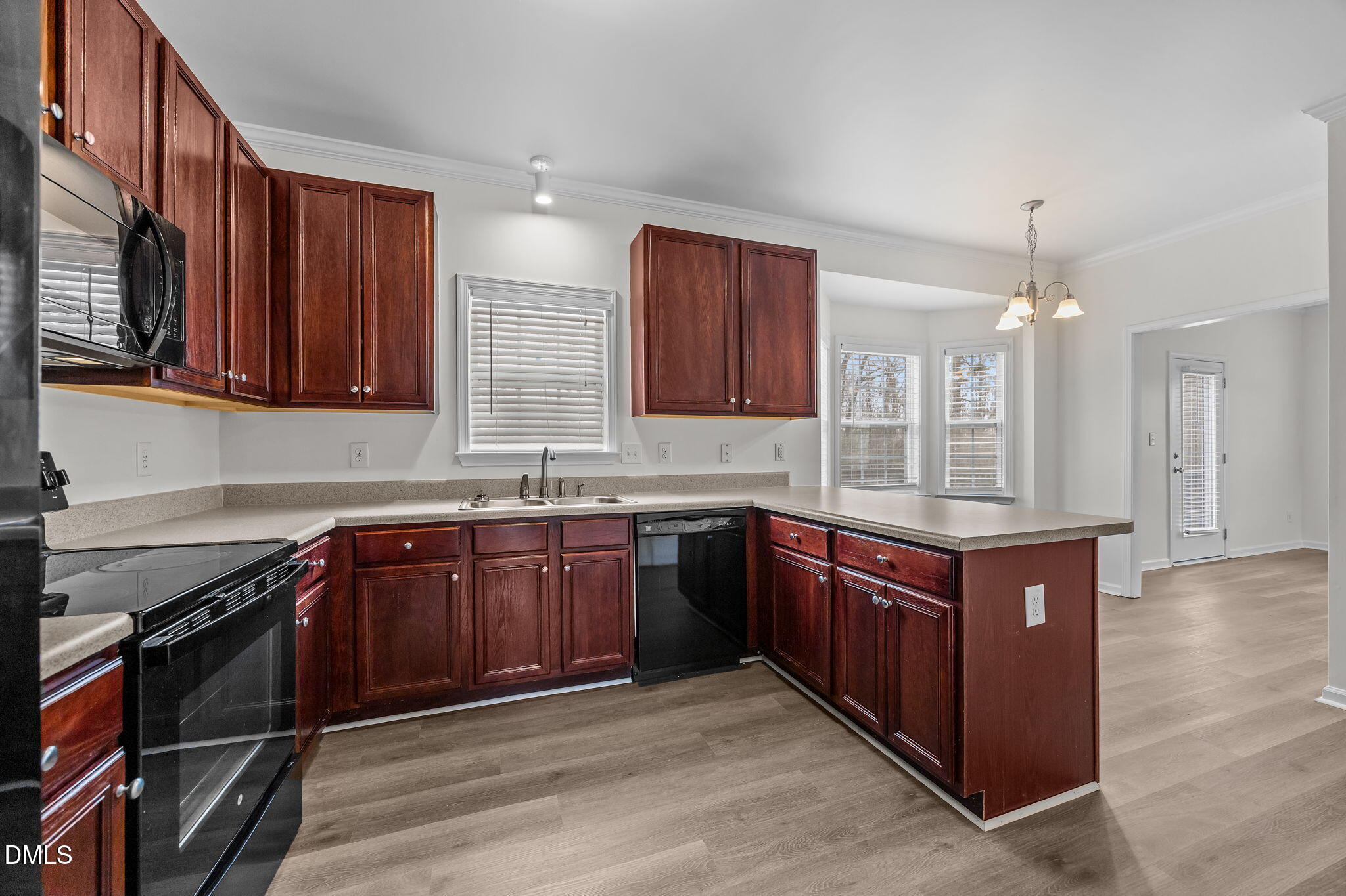1305 Tawny View Lane Raleigh, NC 27603 - Photo 16 of 47 a kitchen with stainless steel appliances granite countertop wooden cabinets a sink and dishwasher