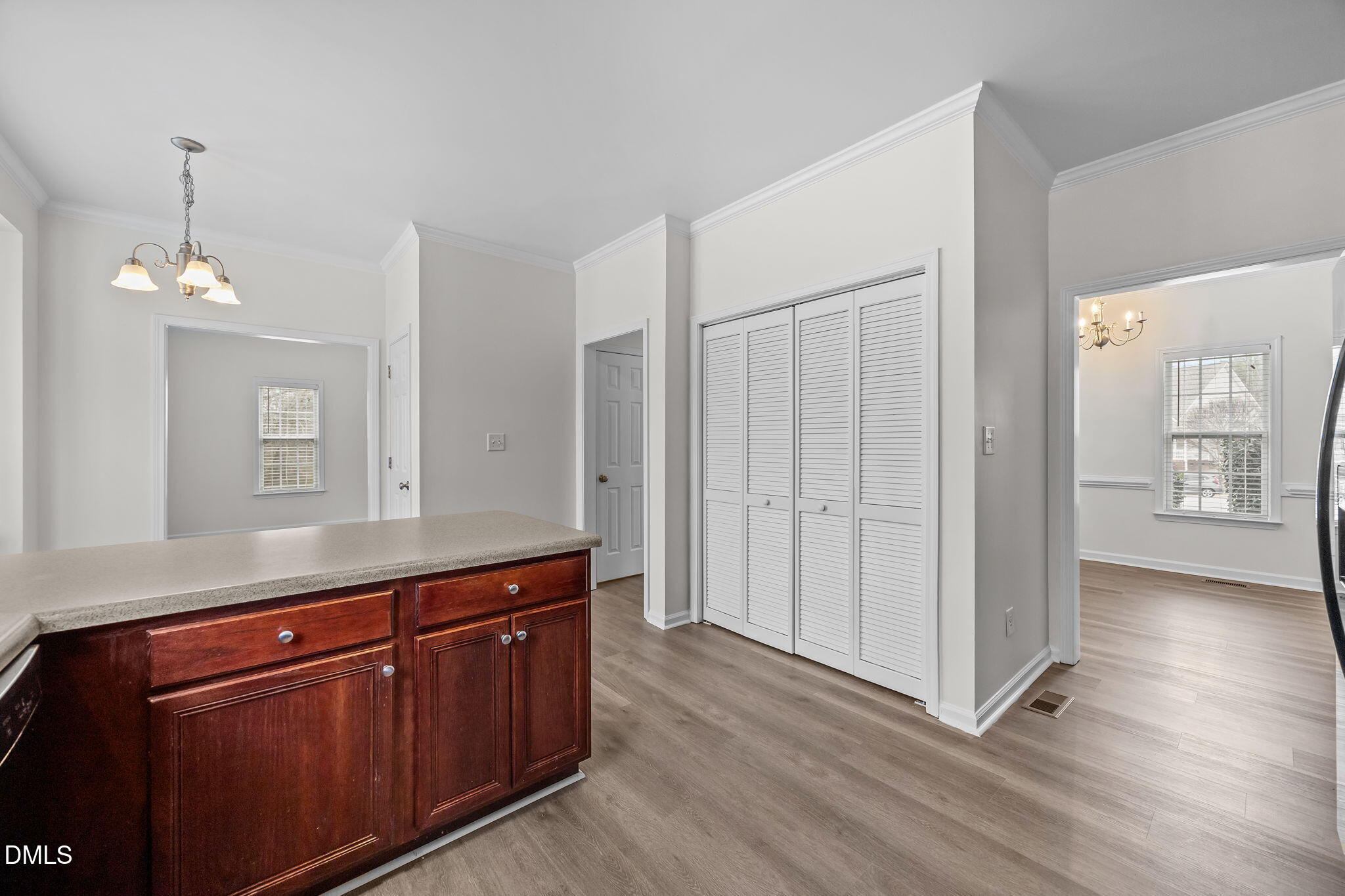 1305 Tawny View Lane Raleigh, NC 27603 - Photo 17 of 47 a kitchen with stainless steel appliances granite countertop a refrigerator a sink and white cabinets with wooden floor