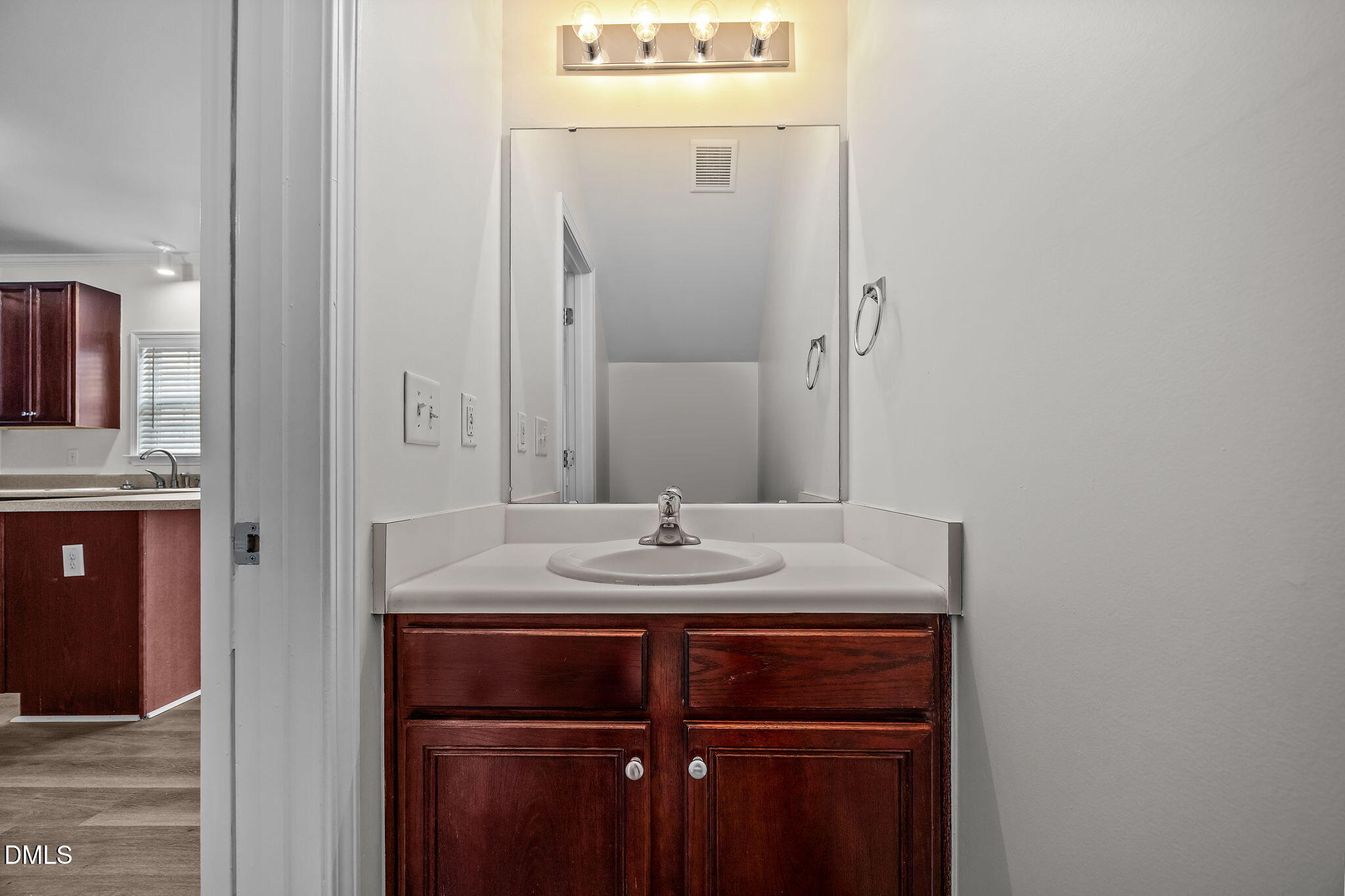 1305 Tawny View Lane Raleigh, NC 27603 - Photo 19 of 47 a bathroom with a granite countertop sink and a mirror