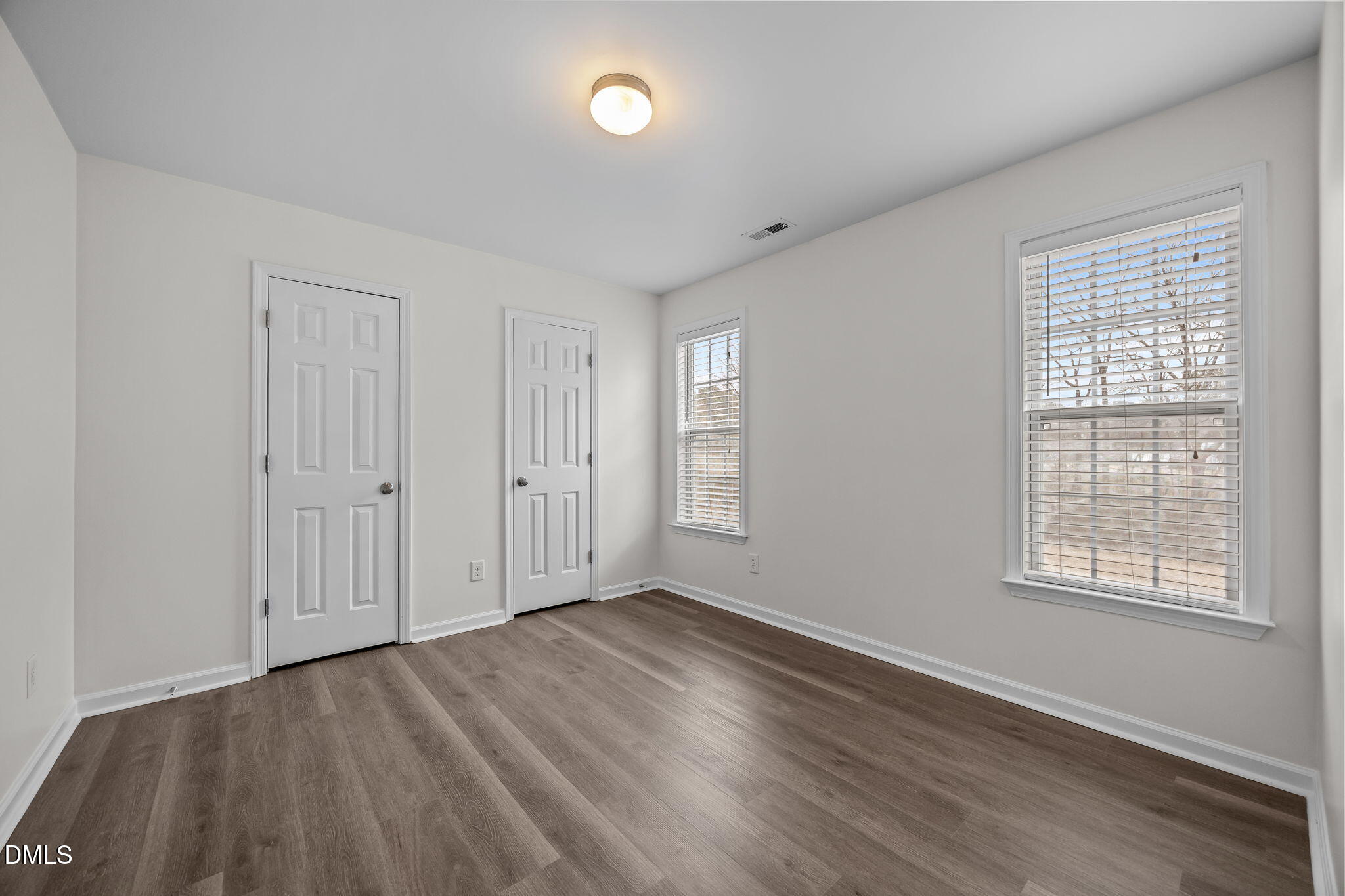 1305 Tawny View Lane Raleigh, NC 27603 - Photo 29 of 47 an empty room with wooden floor and windows