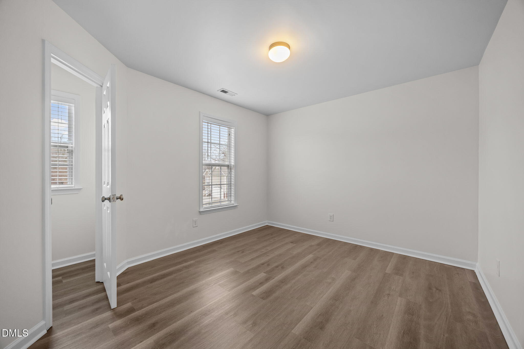 1305 Tawny View Lane Raleigh, NC 27603 - Photo 30 of 47 an empty room with wooden floor and windows