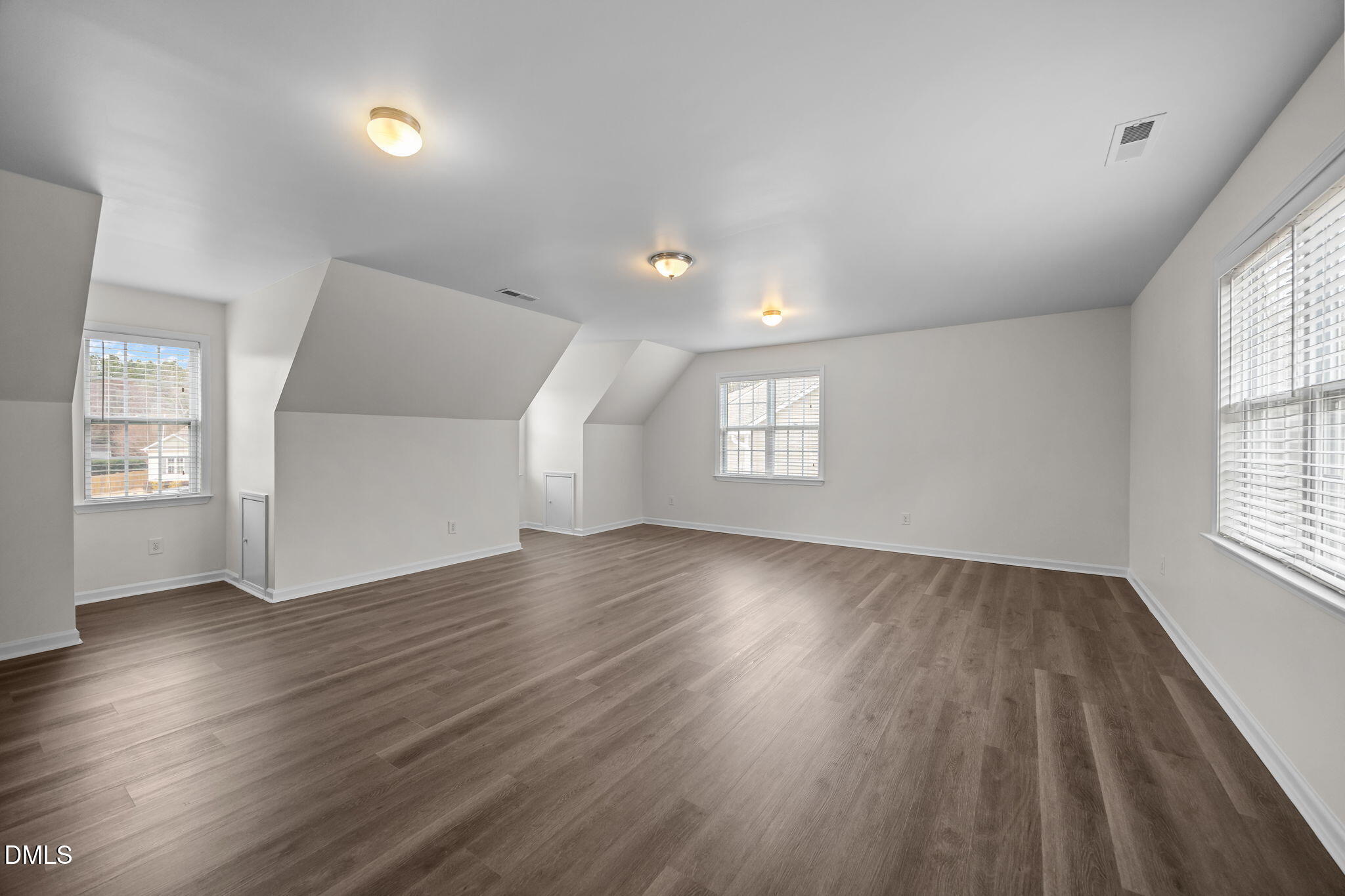 1305 Tawny View Lane Raleigh, NC 27603 - Photo 31 of 47 an empty room with wooden floor and windows