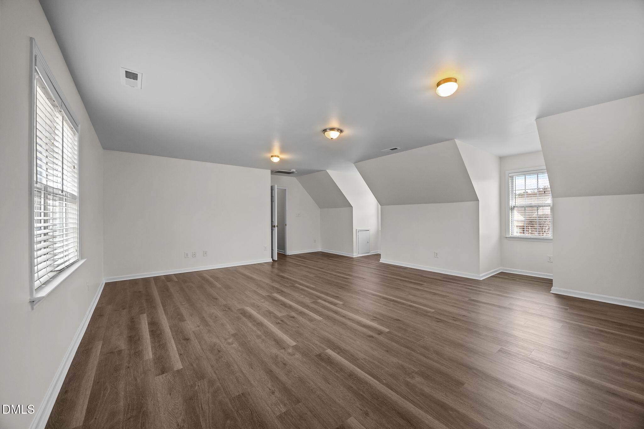1305 Tawny View Lane Raleigh, NC 27603 - Photo 32 of 47 an empty room with wooden floor and windows
