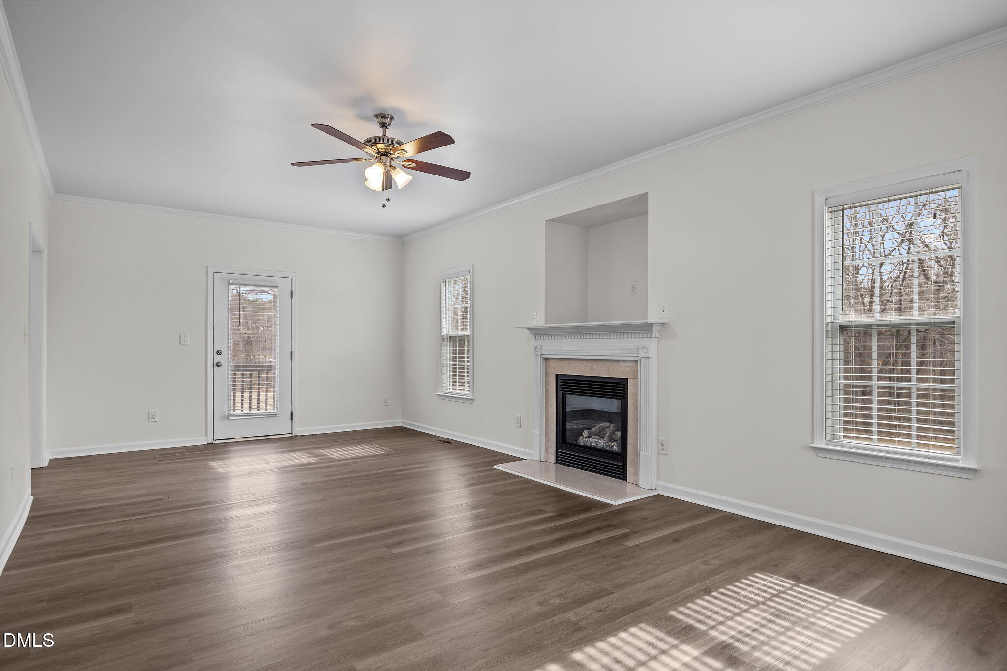 1305 Tawny View Lane Raleigh, NC 27603 - Photo 7 of 47 a view of empty room with wooden floor and fan