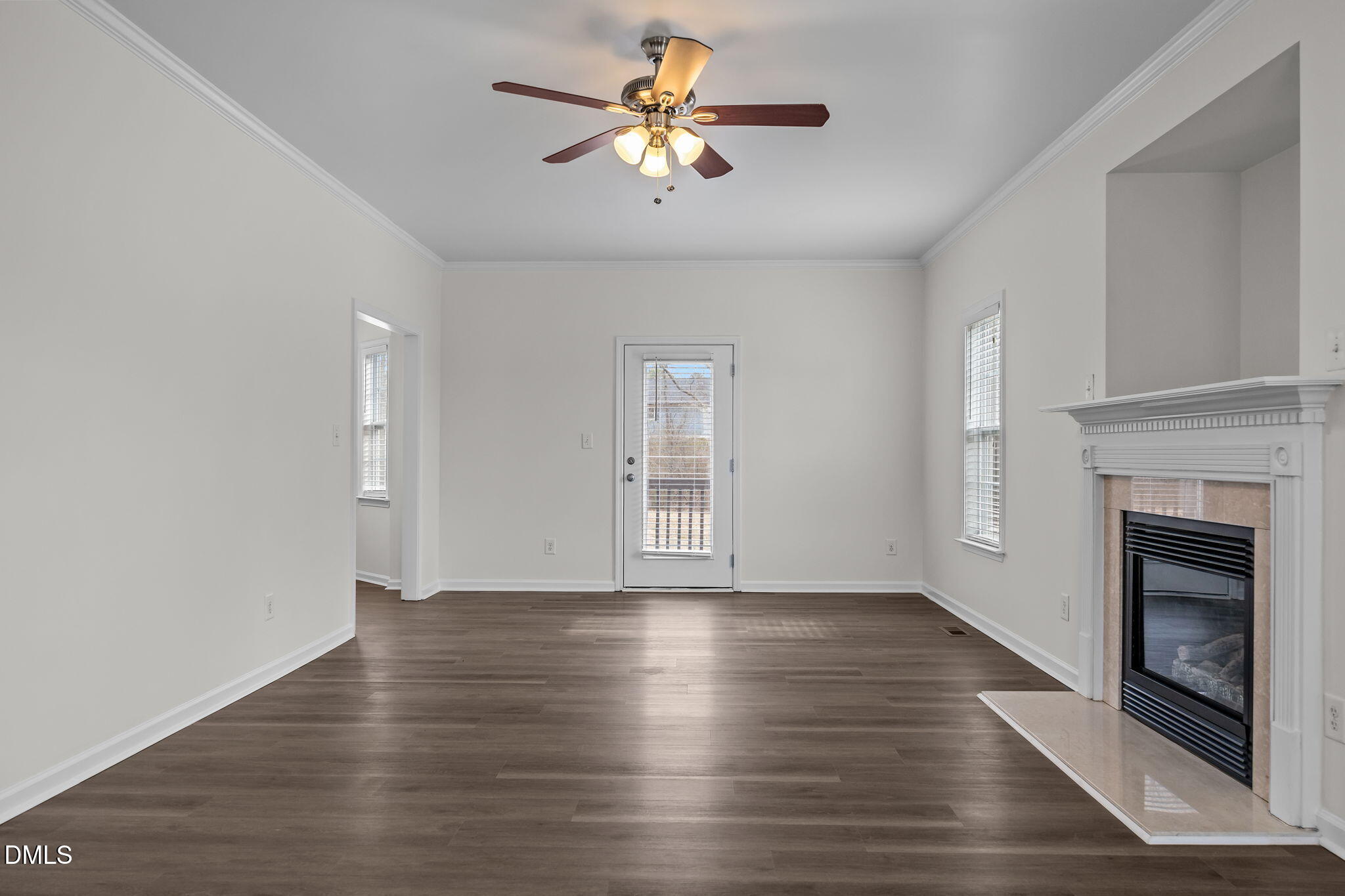 1305 Tawny View Lane Raleigh, NC 27603 - Photo 8 of 47 a view of empty room with wooden floor and a fireplace