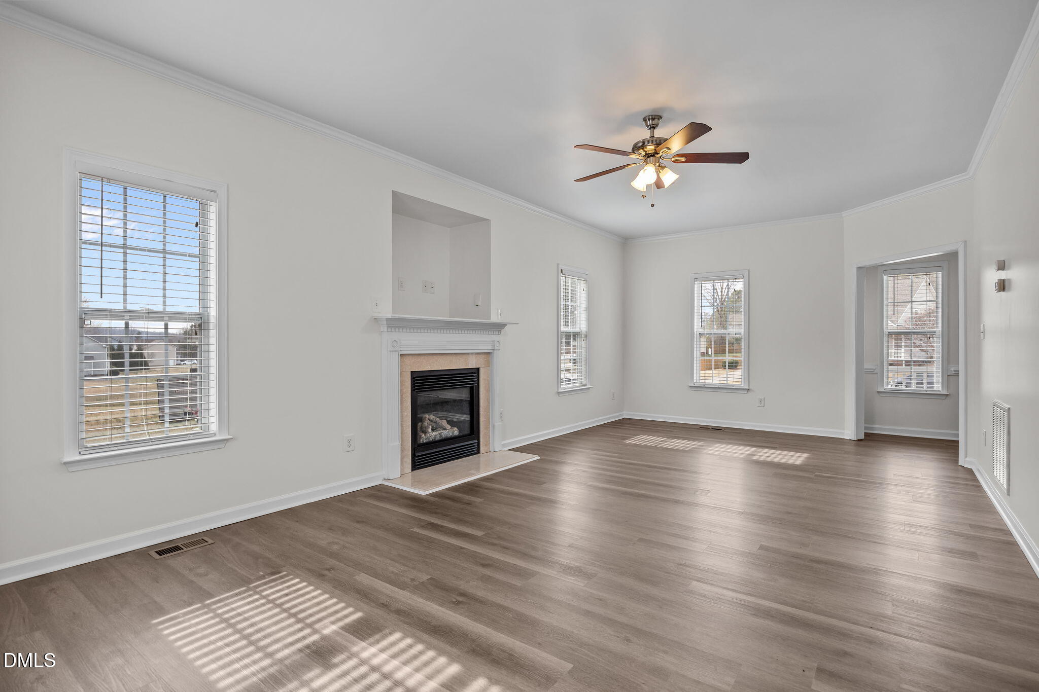 1305 Tawny View Lane Raleigh, NC 27603 - Photo 10 of 47 a view of an empty room with window and wooden floor