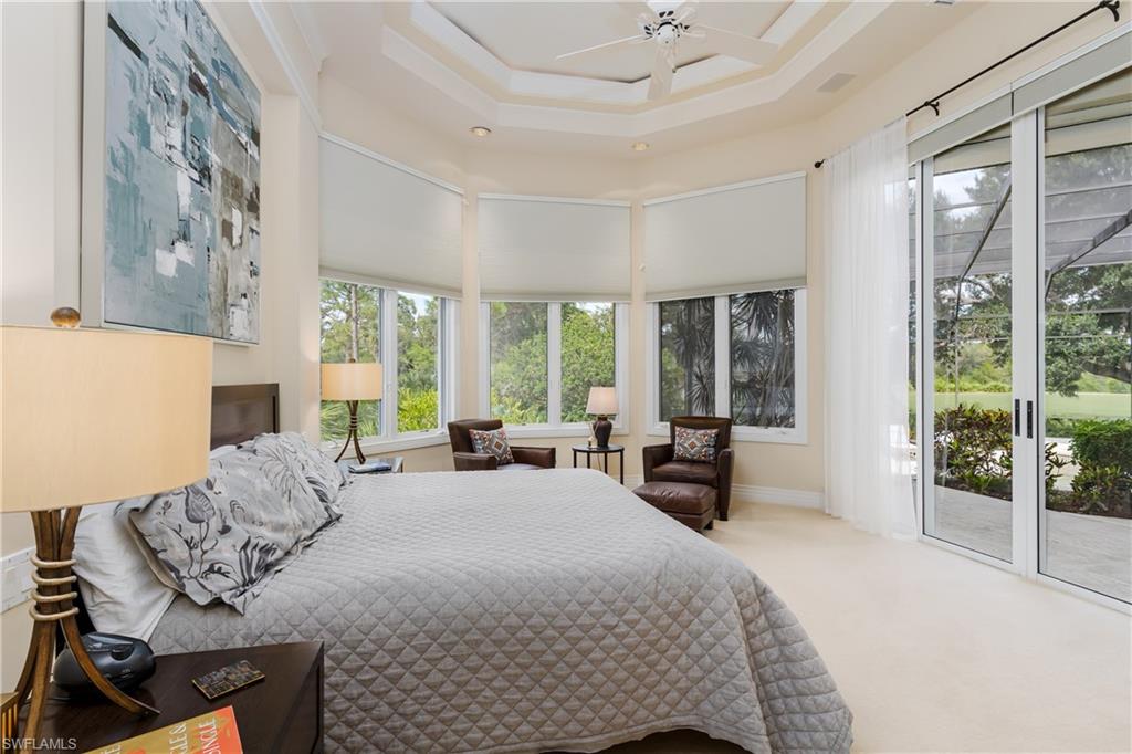 1150 Dimock Lane Naples, FL 34110 - Photo 11 of 40 a bedroom with a bed and large windows