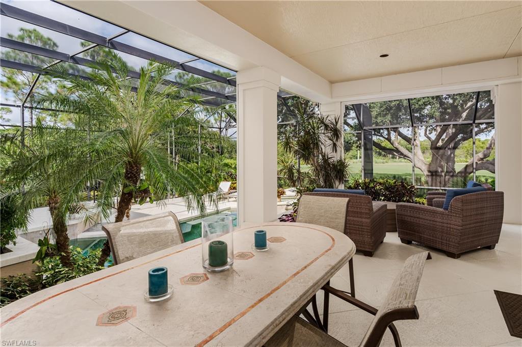 1150 Dimock Lane Naples, FL 34110 - Photo 28 of 40 a outdoor dining space with furniture and garden view