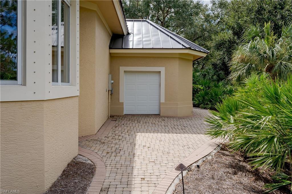 1150 Dimock Lane Naples, FL 34110 - Photo 38 of 40 a view of a house with a yard