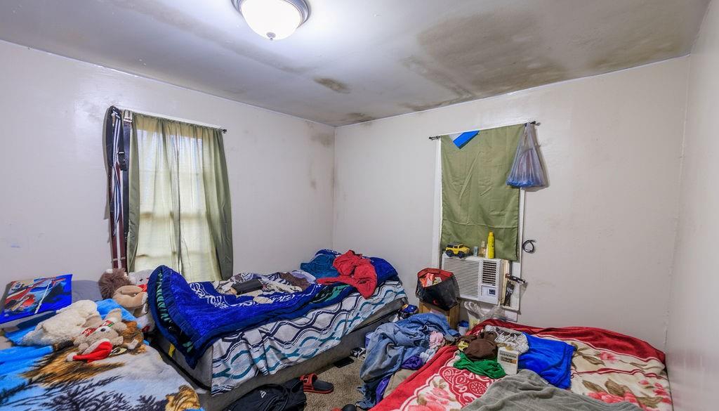 100 Daisy Circle Canton, GA 30114 - Photo 7 of 8 a bedroom with a bed and a window